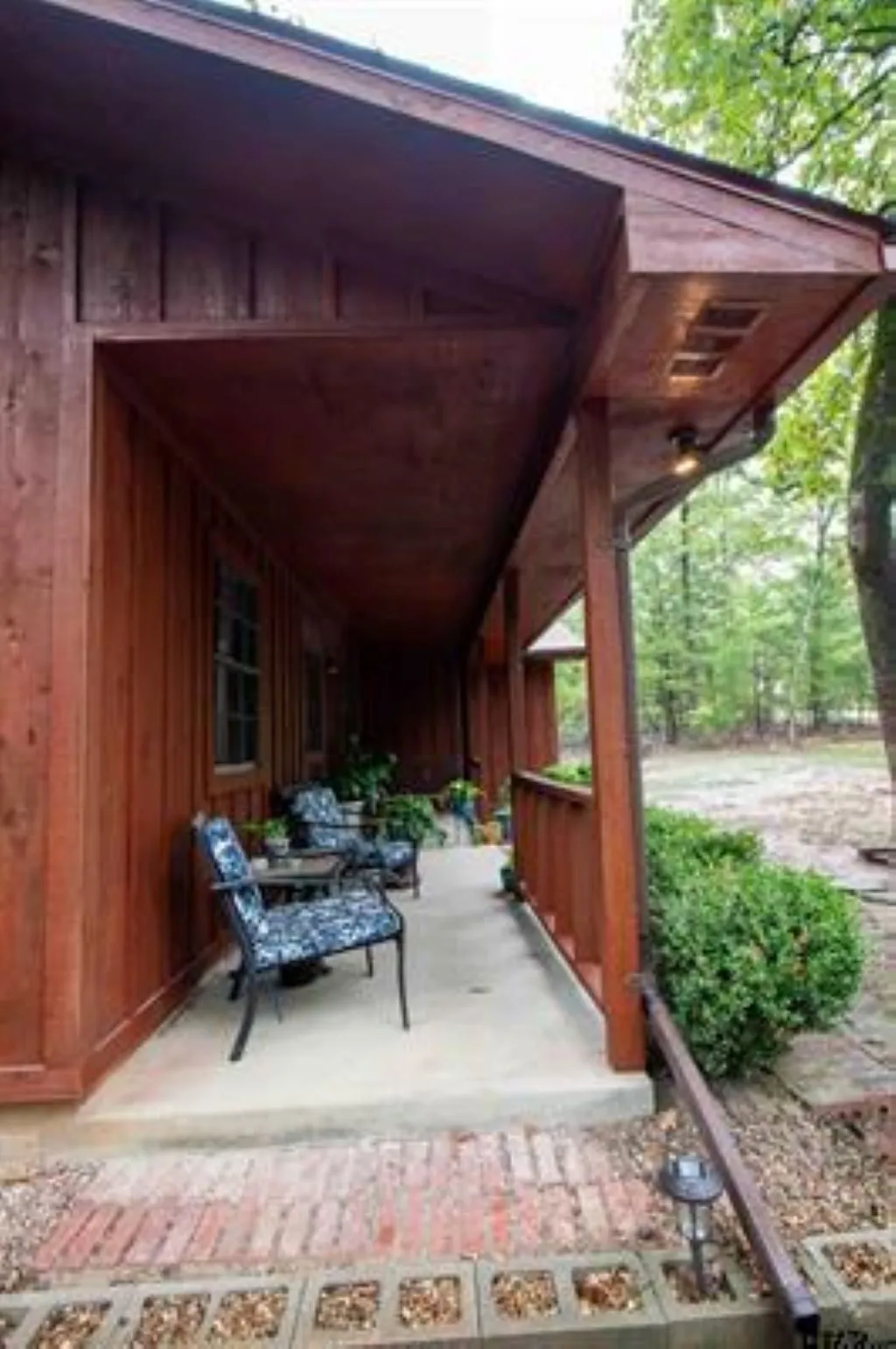 Nice covered front porch to watch nature.