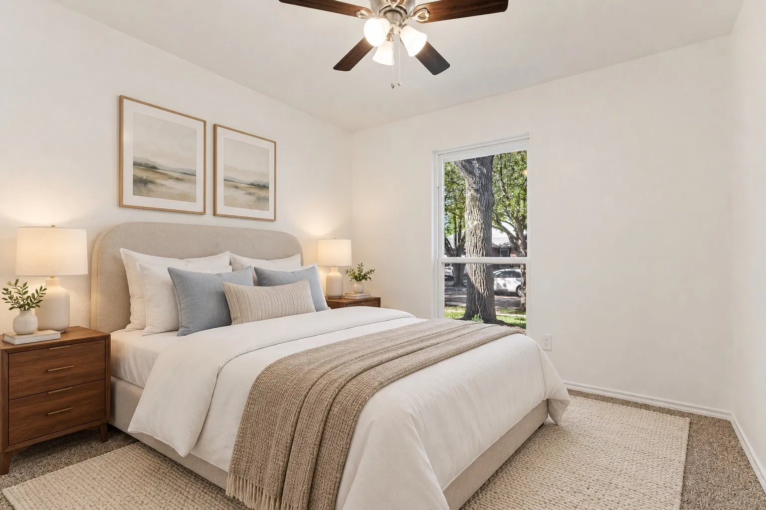Recessed window, ceiling fan with light fixture, light-colored walls, and carpet flooring