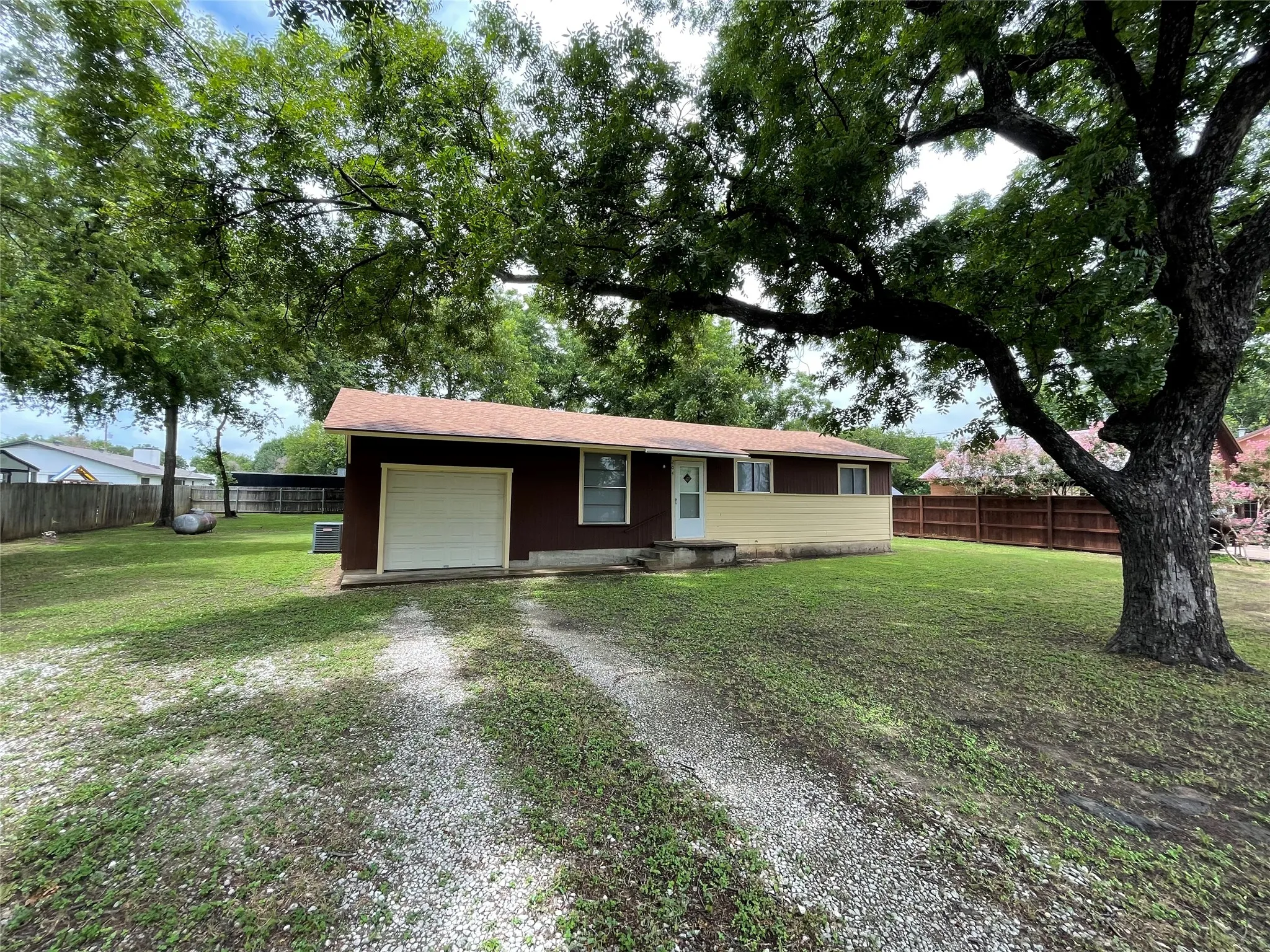 Nestled under mature shade trees, 204 E 6th Street is a hidden gem!