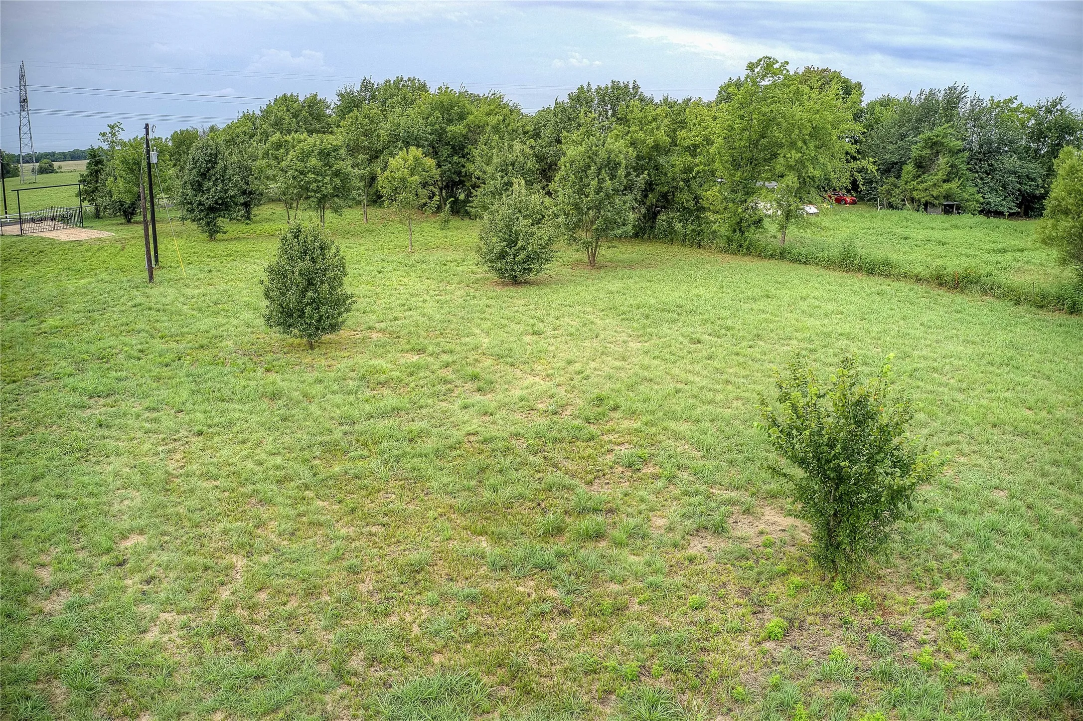 View of green lawn with a view of rural / pastoral area