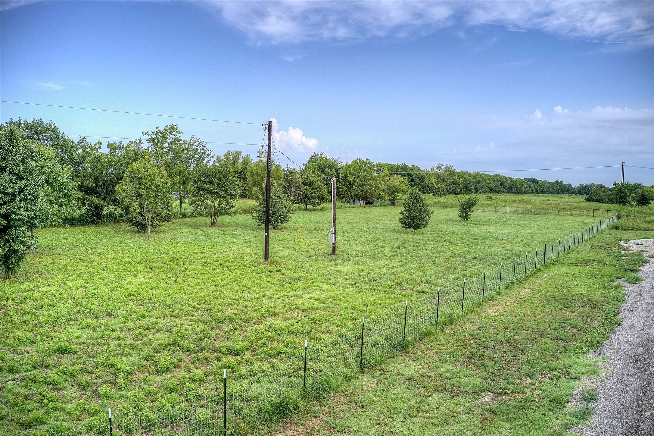 View of yard with a rural view