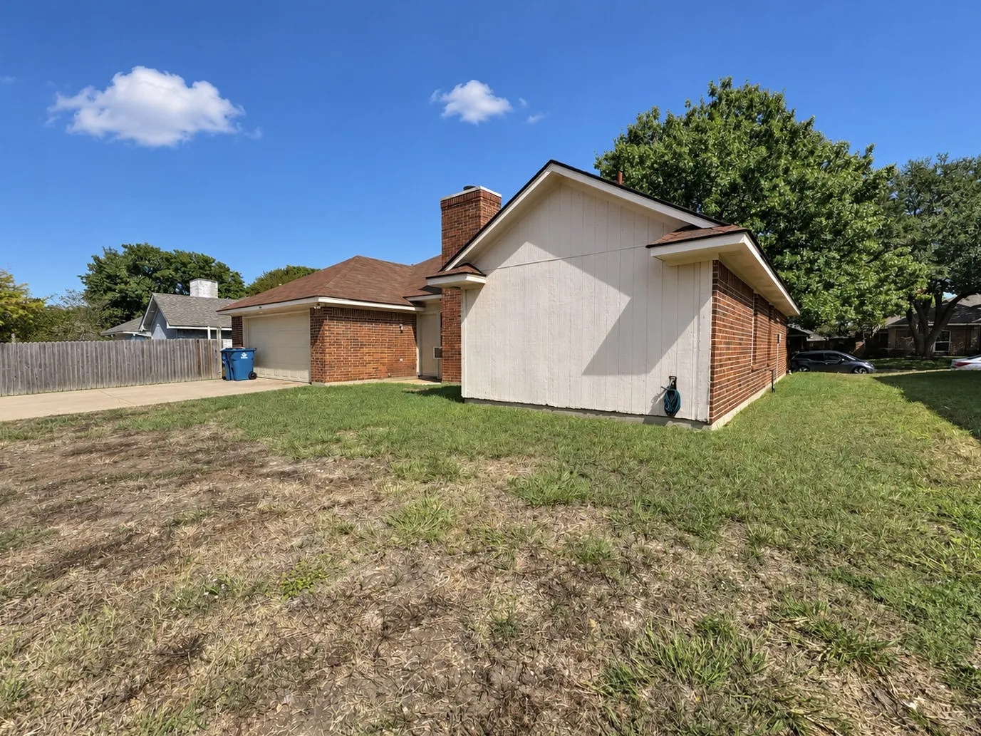 Brick and siding exterior with a shingle roof