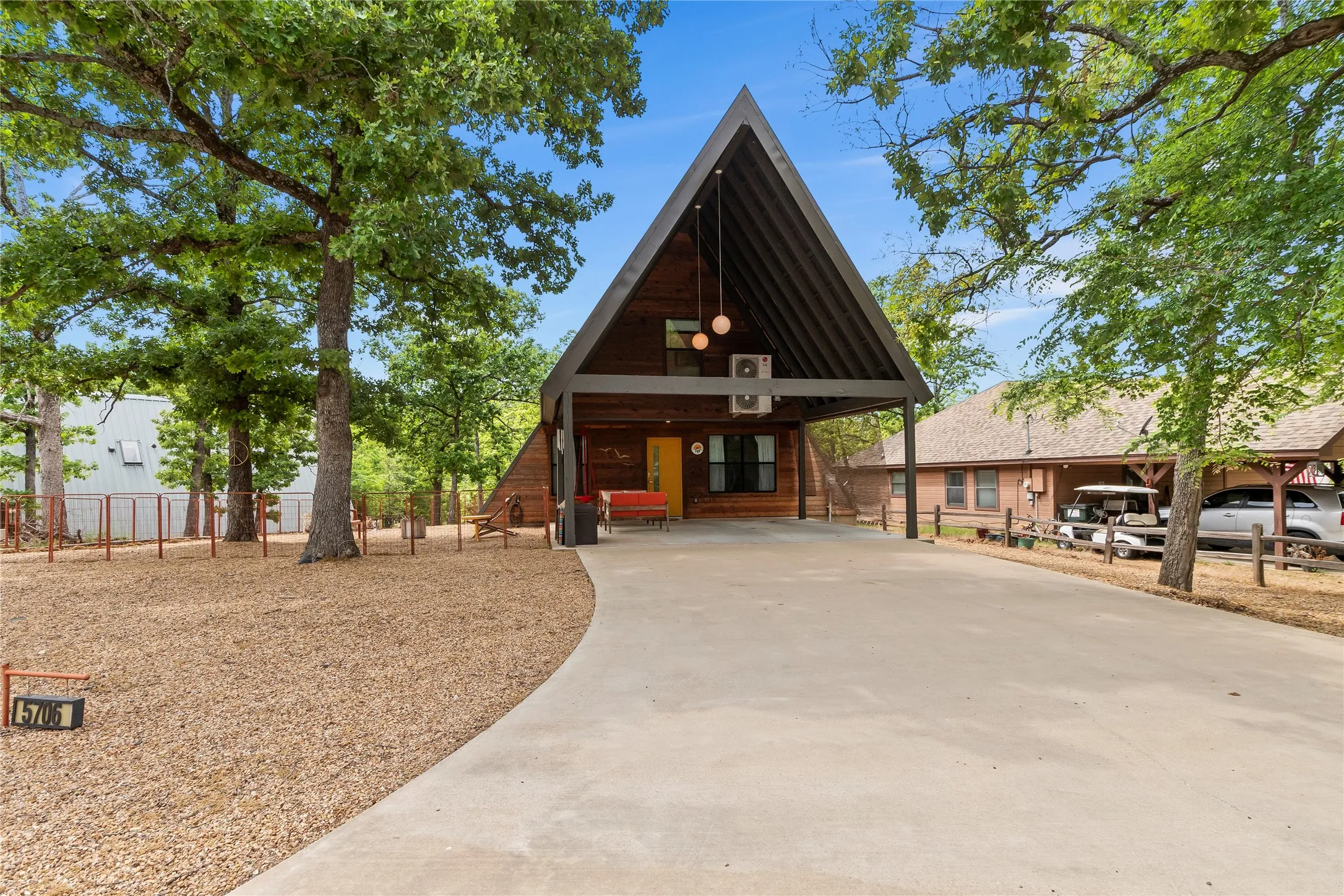 Front of home, concrete drive with covered