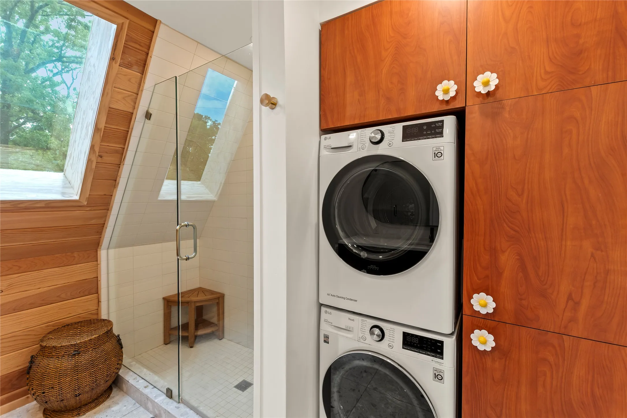 Guest bathroom shower/ laundry stackable apartment sized washer and dryer