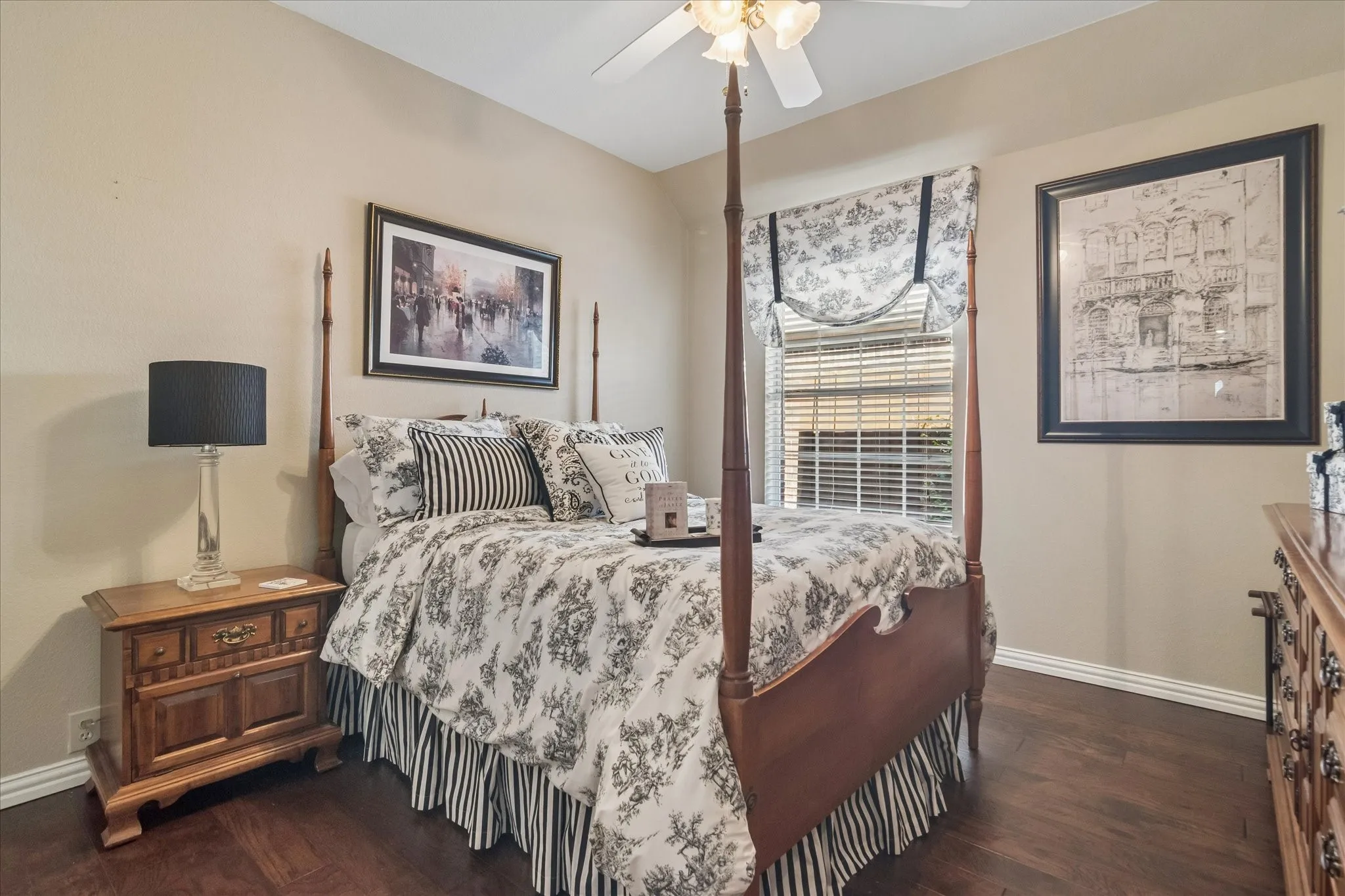 Wood-finish flooring, ceiling fan with integrated lighting, window with blinds, and white trim