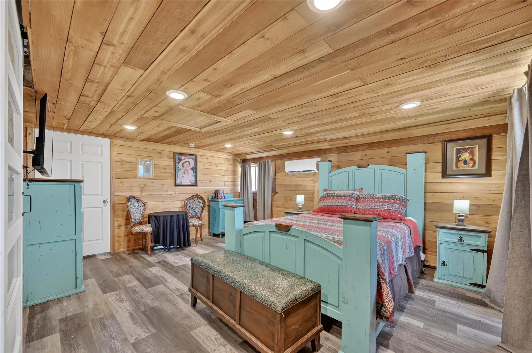 Wood-paneled walls and ceiling with recessed lighting