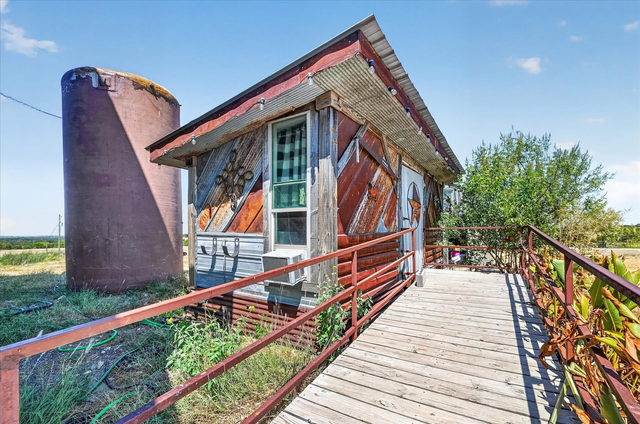 Wood-finish exterior siding with corrugated metal accents