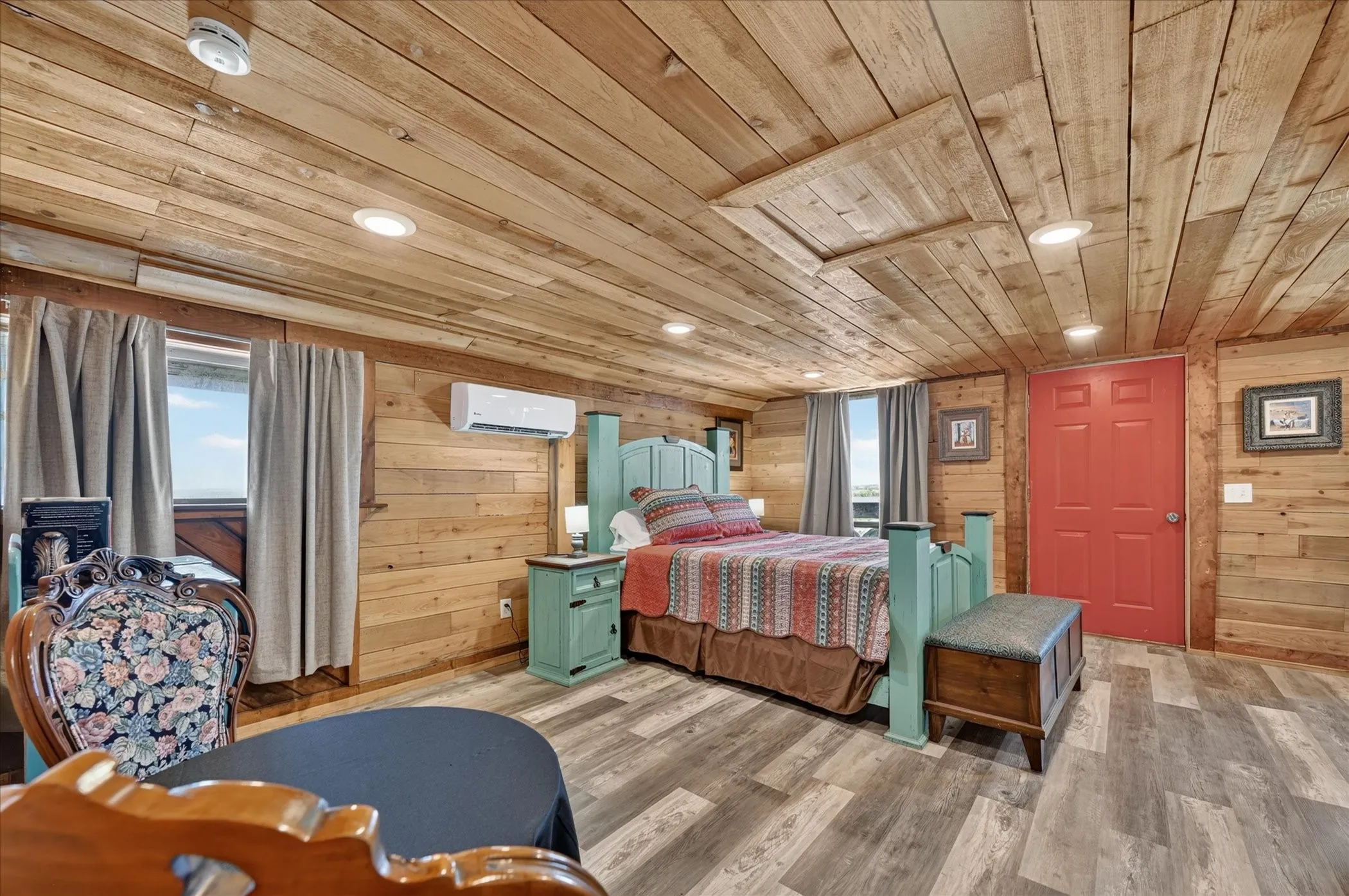 Wood-paneled walls and ceiling with recessed lighting
