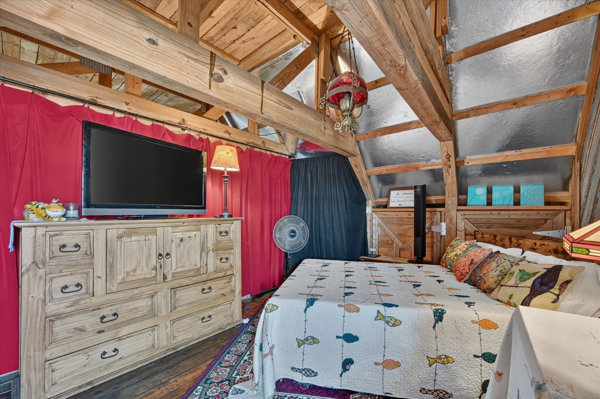 Exposed wood beam ceiling, wood-paneled walls, and wood-finish flooring