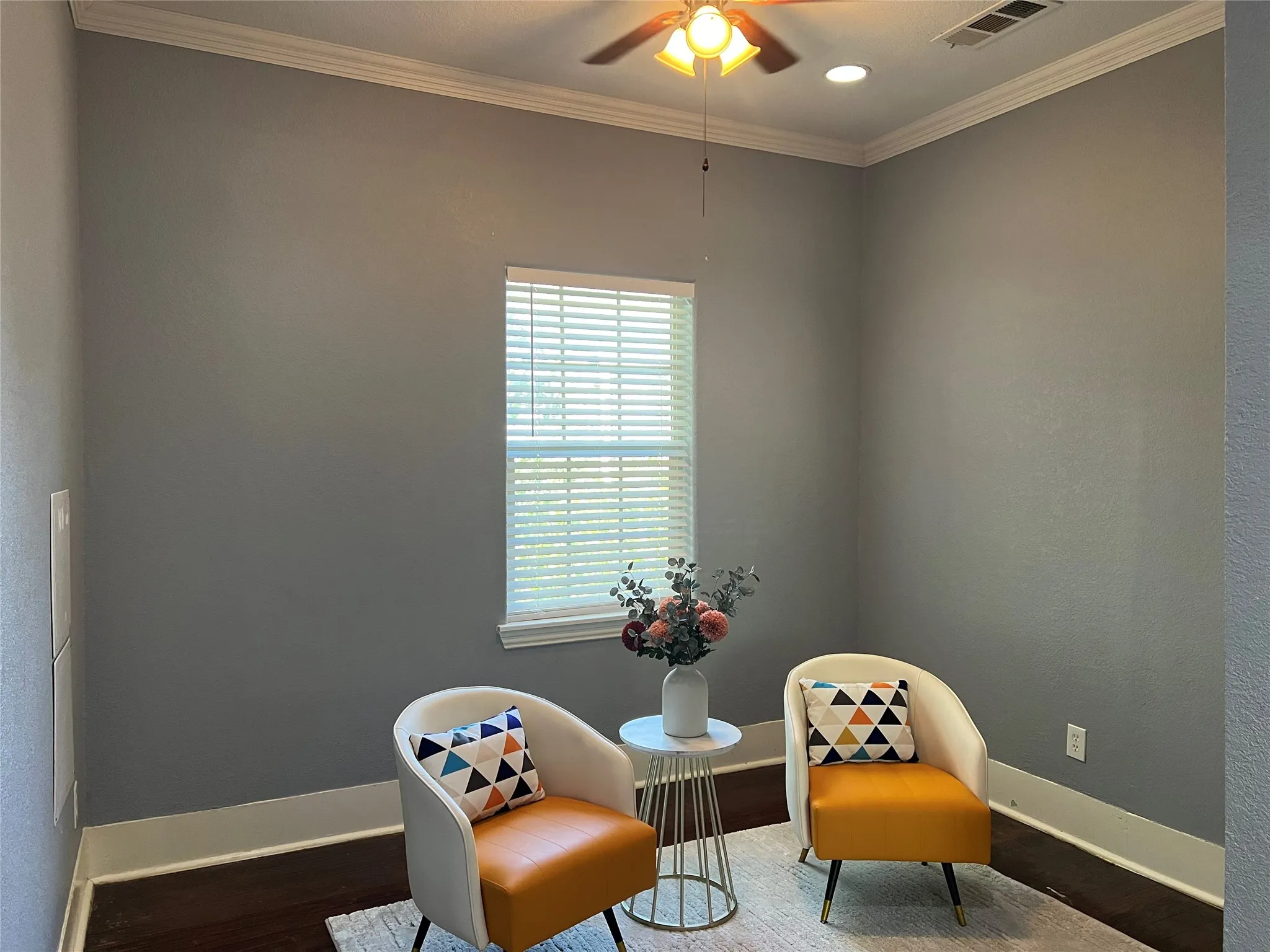Recessed lighting, ceiling fan with light fixture, crown molding, and wood-finish flooring