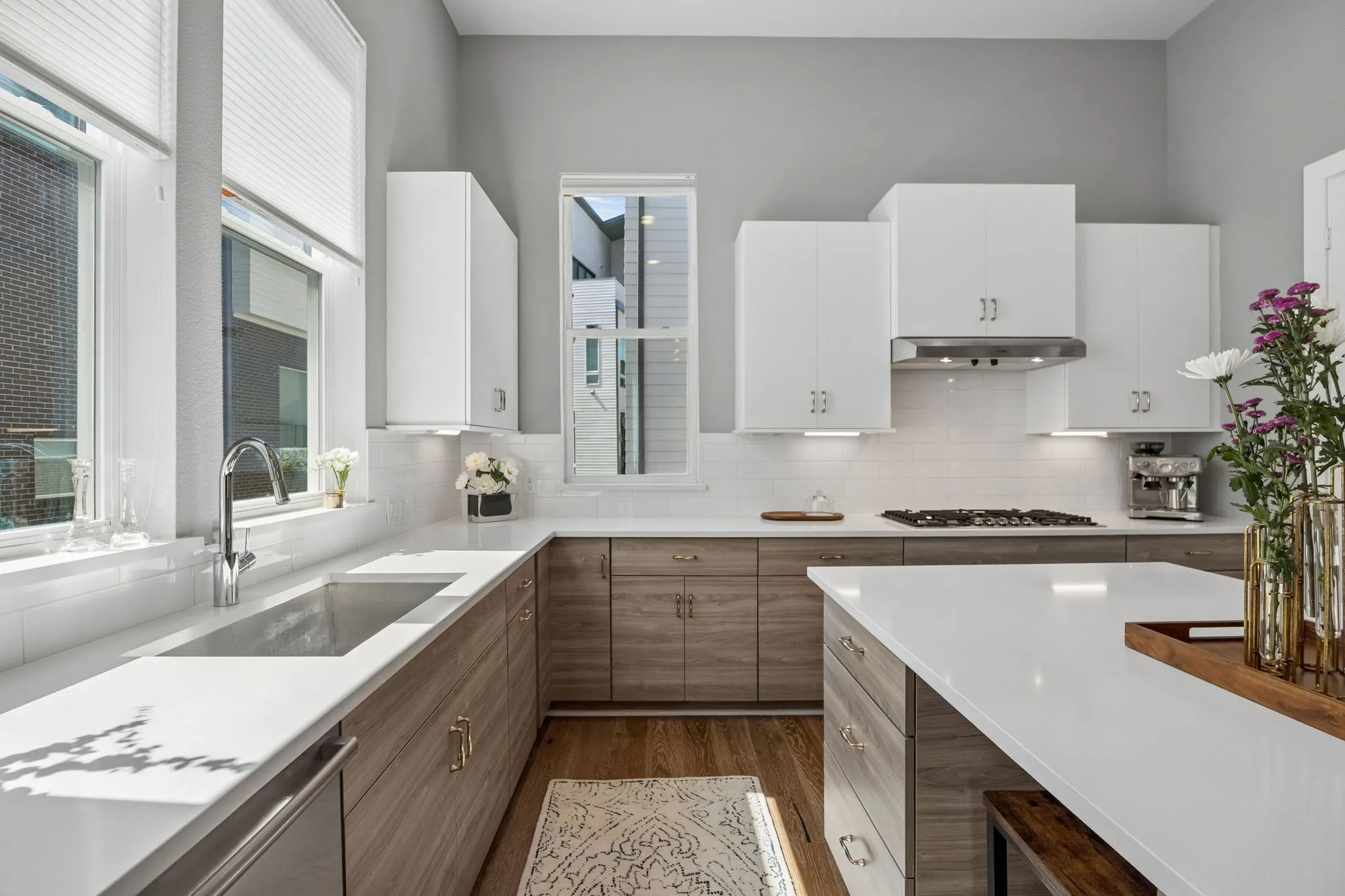 Island allows for sitting and gathering, and additional space for a beverage fridge