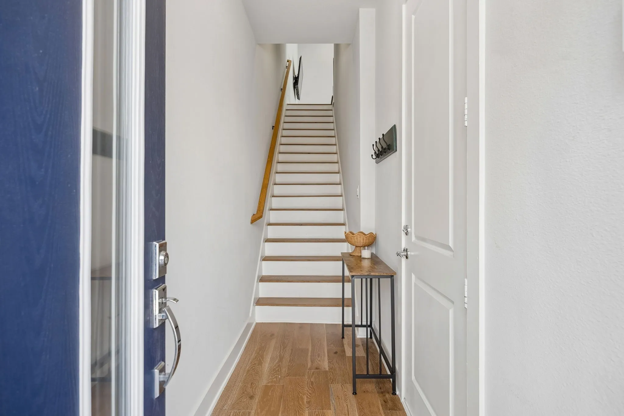 A beautiful front entryway greets you with warm engineered hardwoods sharing access to your private 2-car tandem garage.