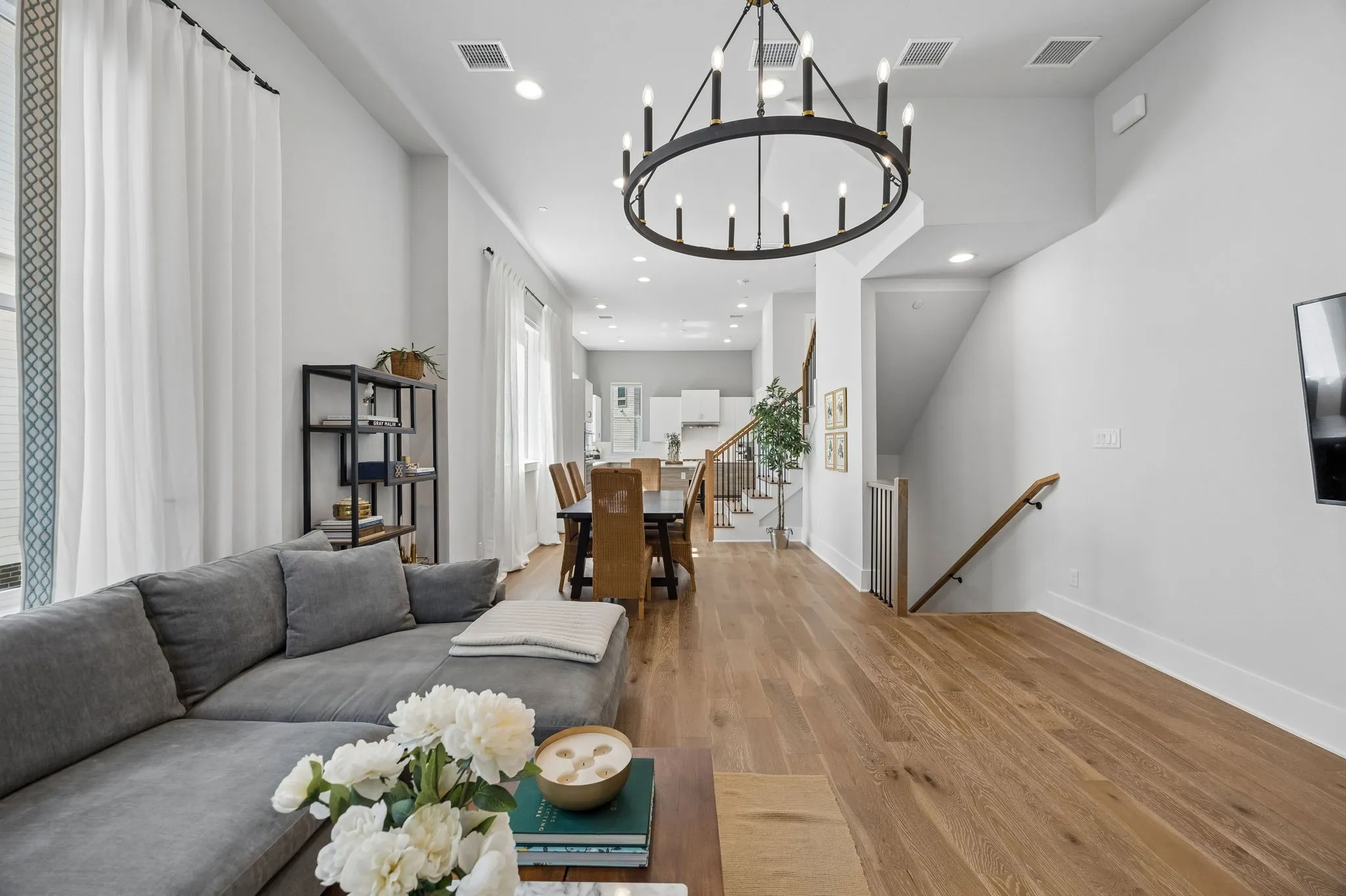 Second floor features 12-foot ceilings anchored by luxurious engineered hardwoods and a floorplan that makes this feel like a home.