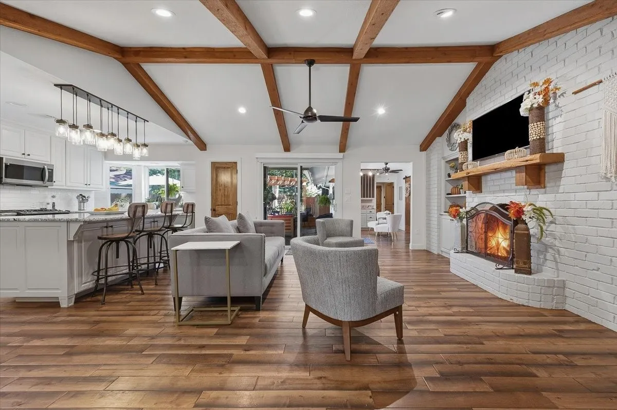 Wood beamed raised ceiling adds charm.