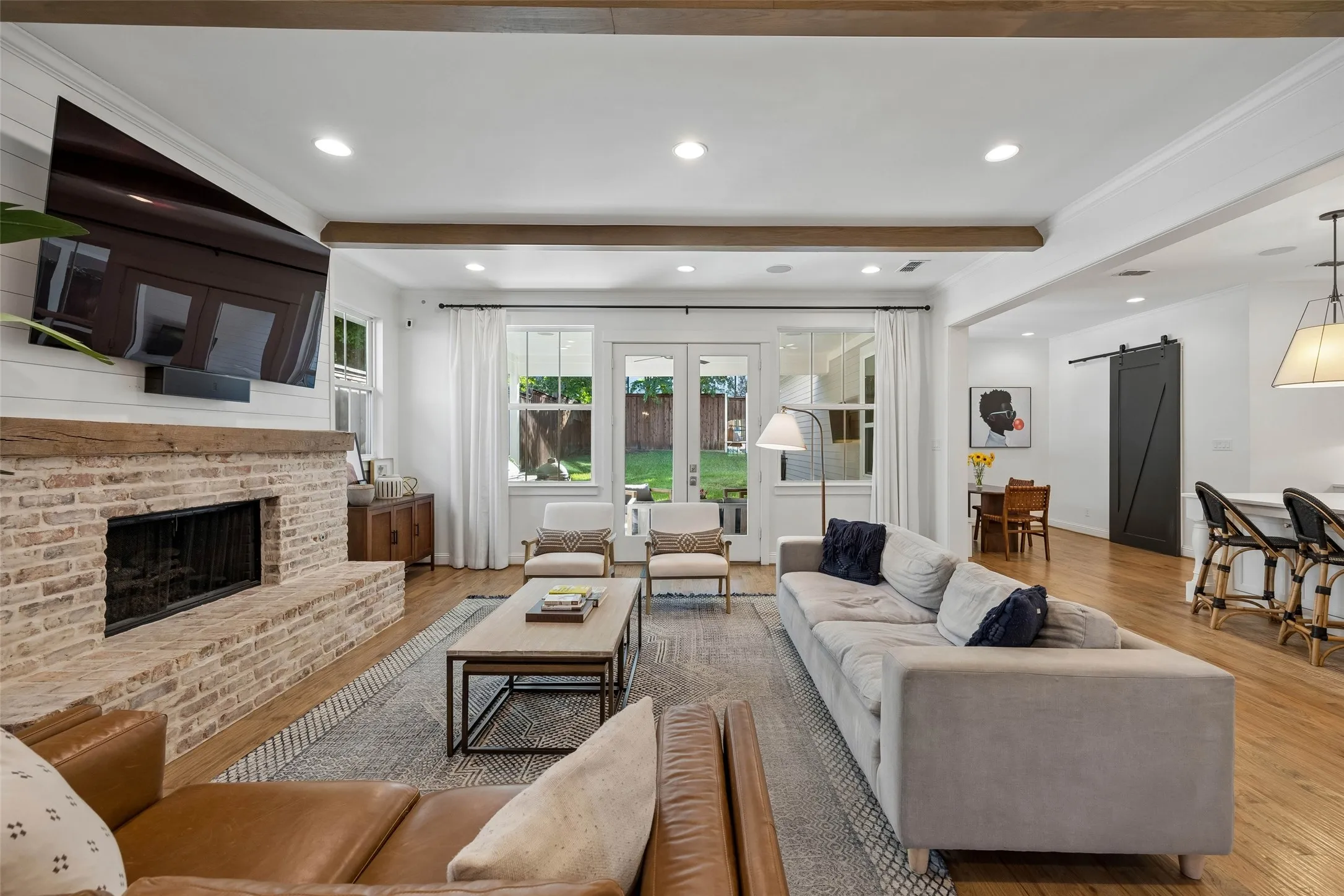 Open main living room with full views of the backyard