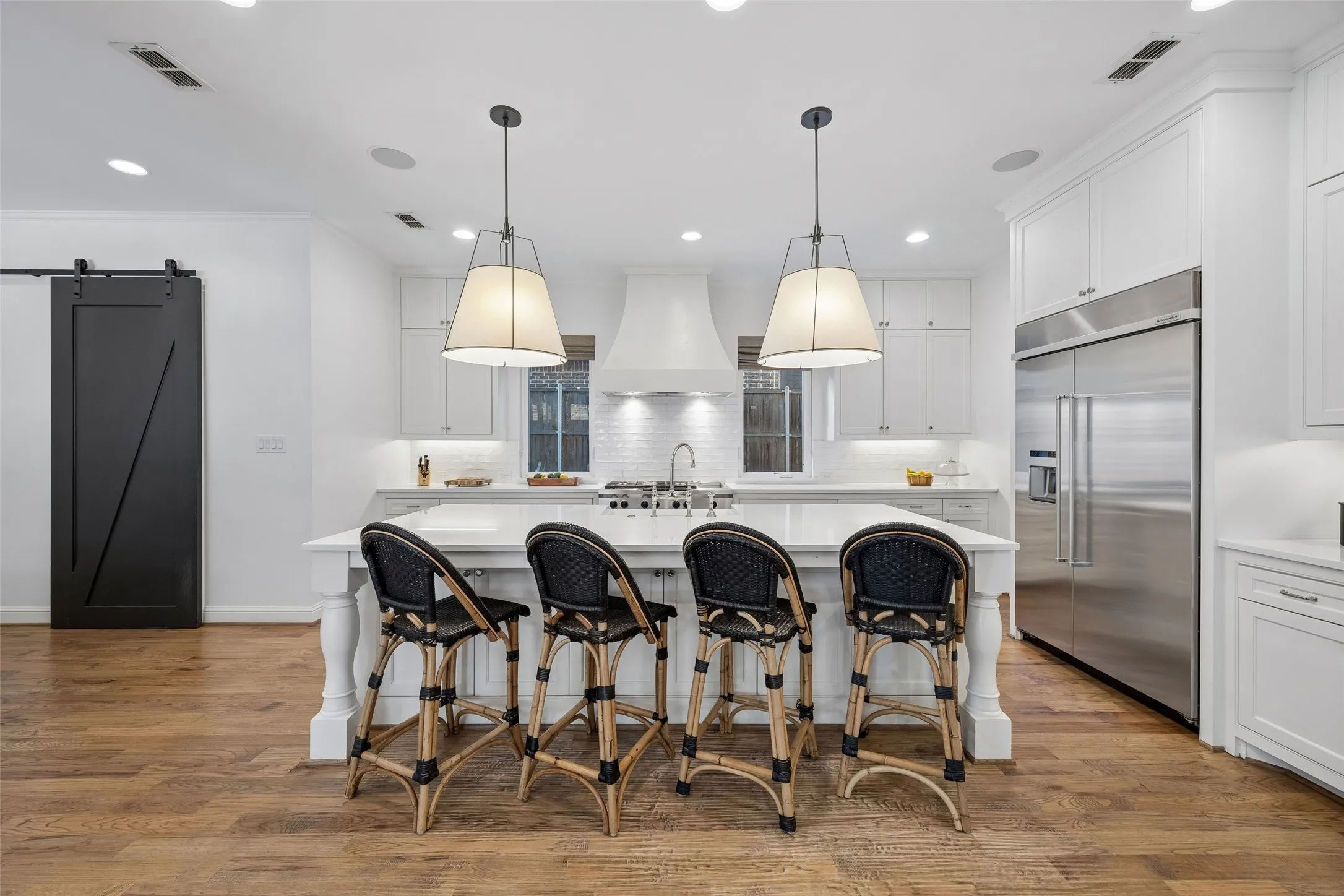 Beautiful white on white kitchen with  walk in pantry.