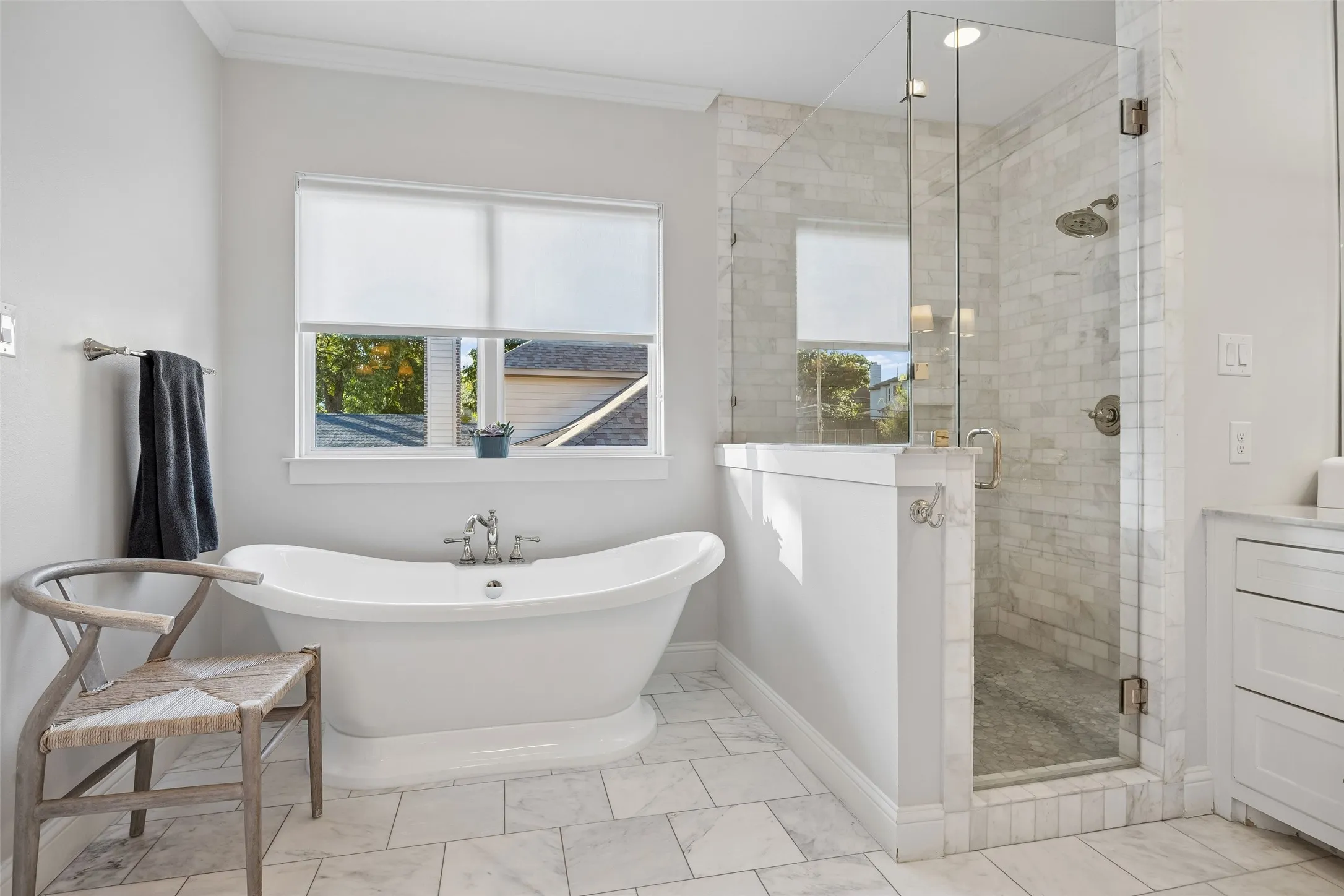 Primary bathroom with separate soaking tub an walk in shower.