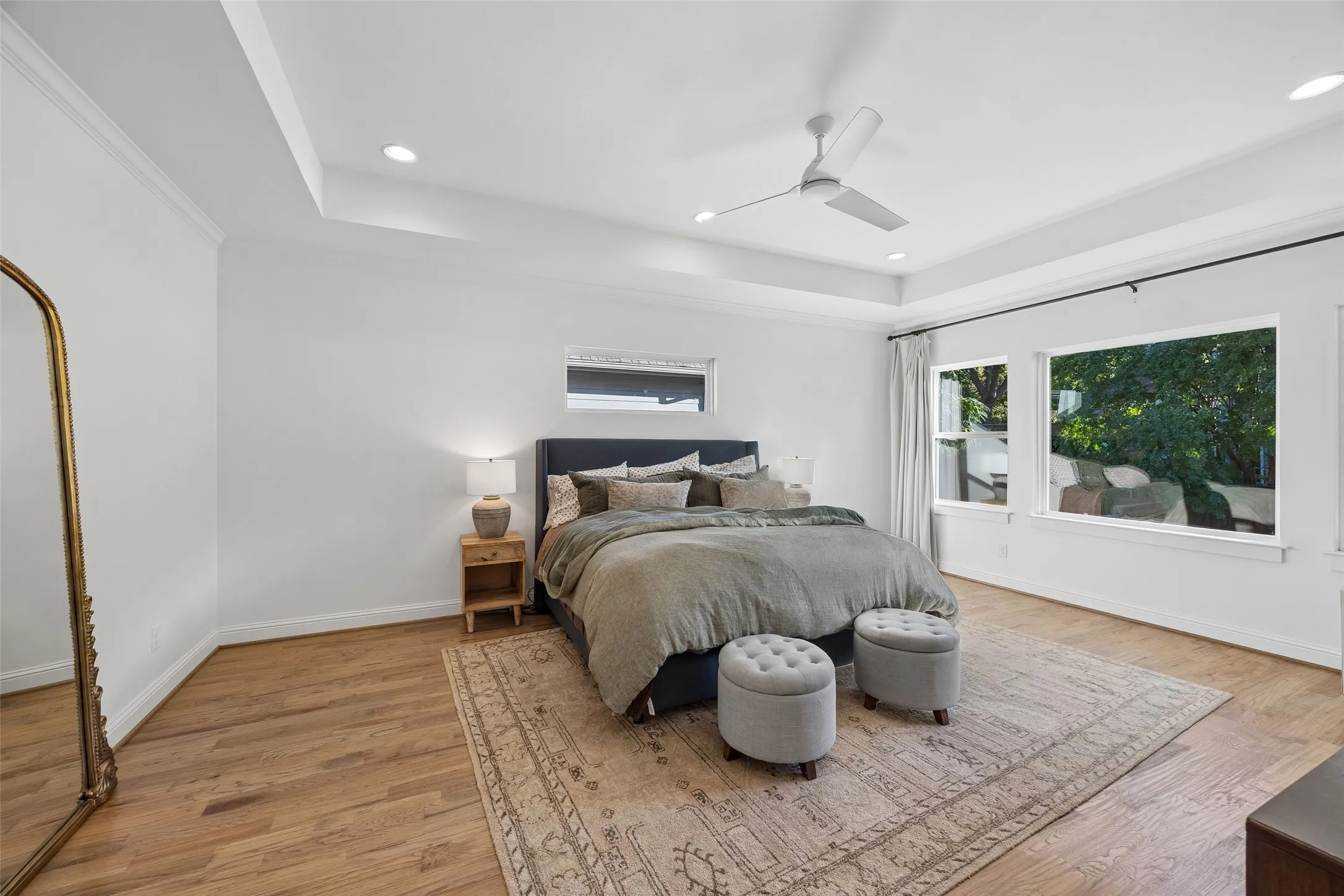 Primary bedroom. Wood floors. Located on the second floor in the rear of the home.