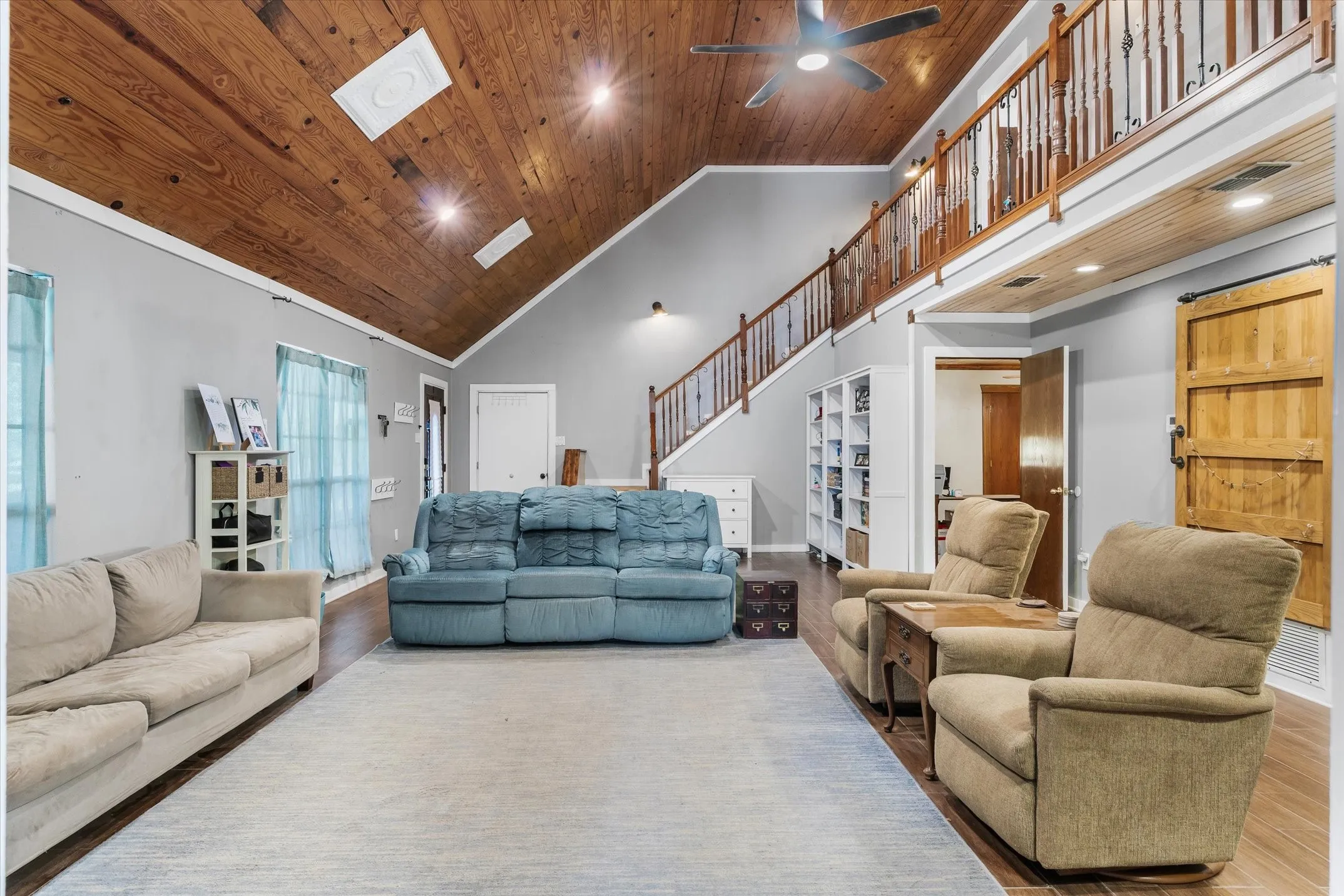Wood plank ceilings and can lighting.
