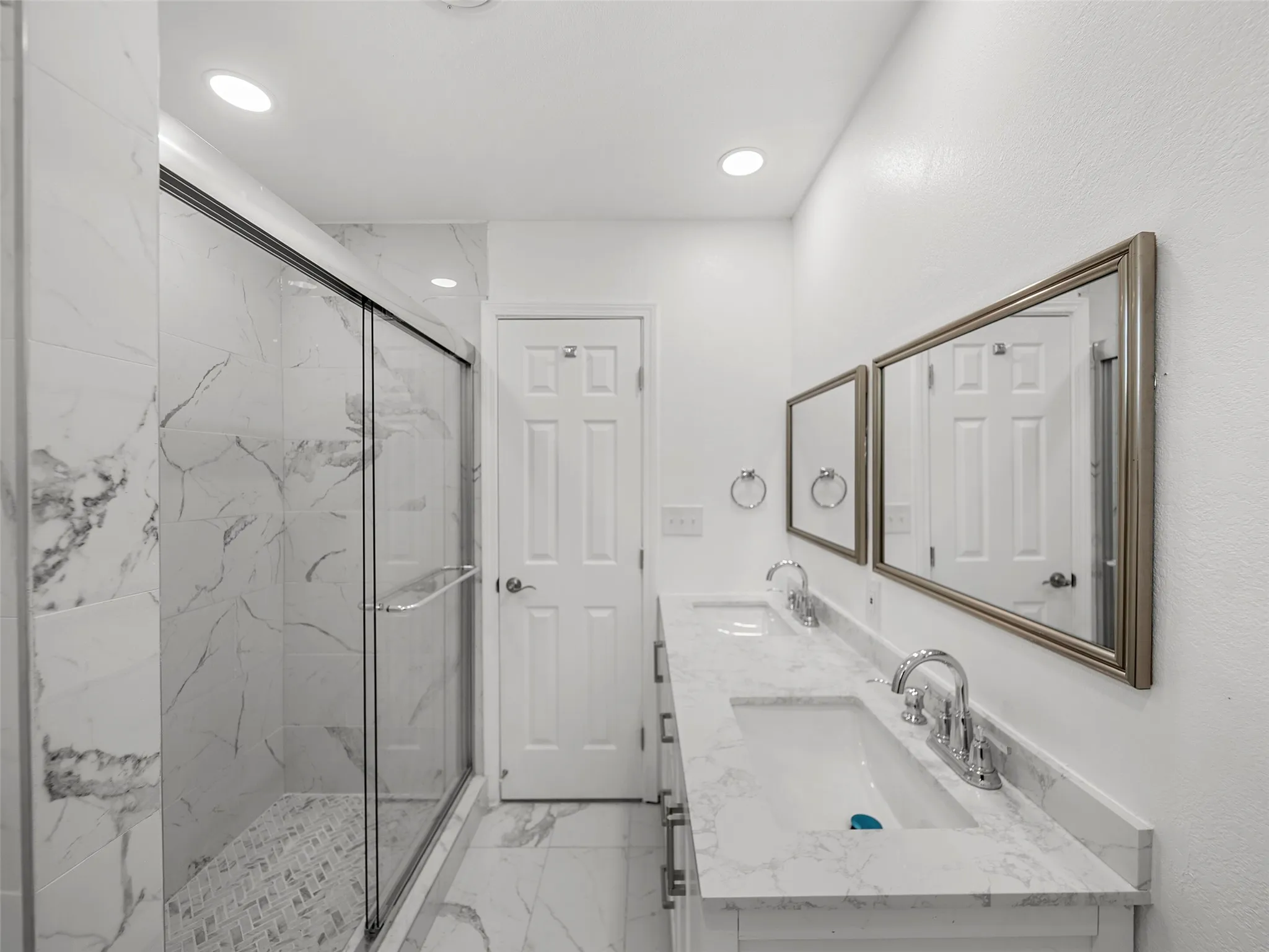 Dual vanity with integrated sinks and chrome fixtures
