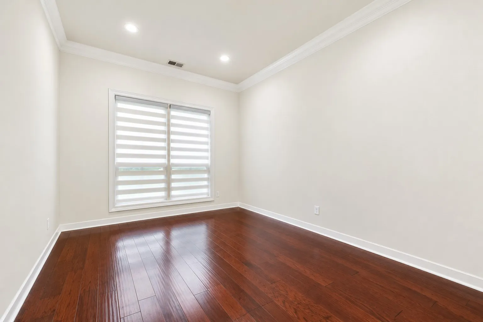 Hardwood flooring, crown molding, recessed lighting, white trim, and a window with blinds
