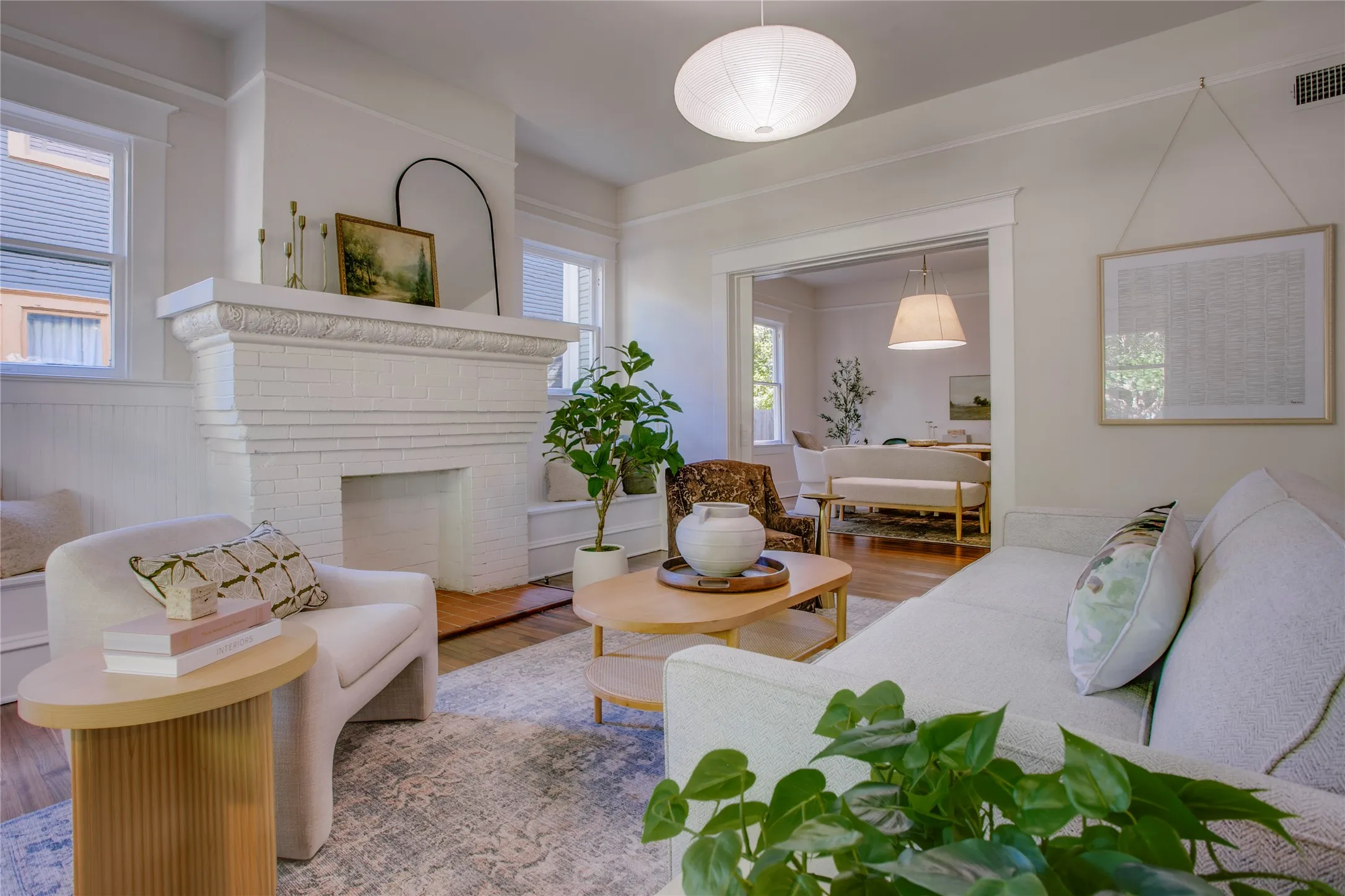 Note the artwork on the right, It is hung from the original picture rail molding using a hook and braided cording.