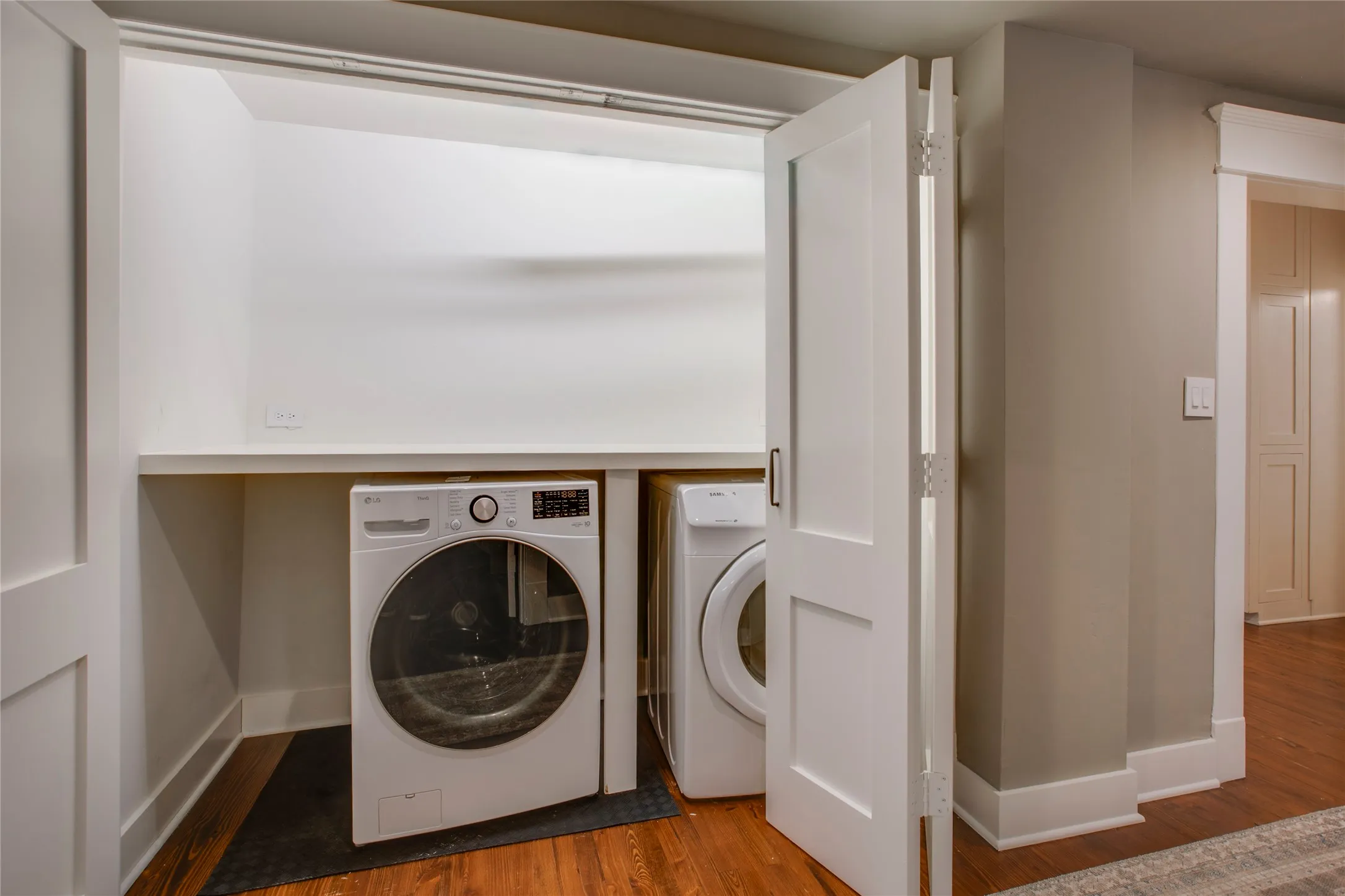 Full sized washer-dryer in the downstairs laundry closet