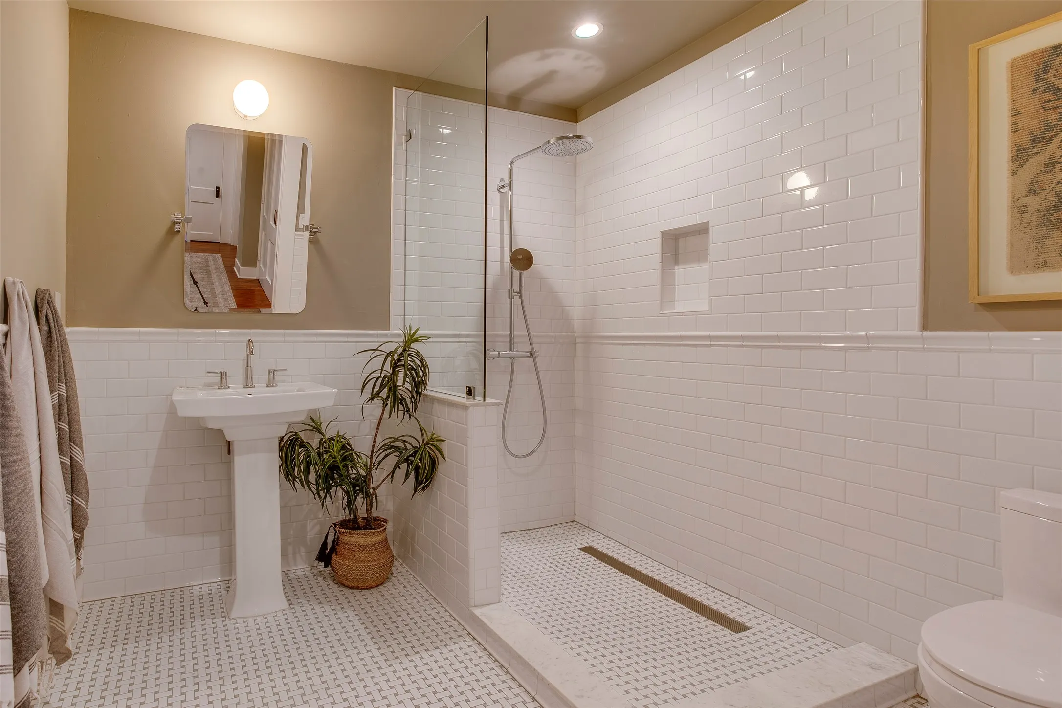 Full downstairs bath with tiled walk-in shower