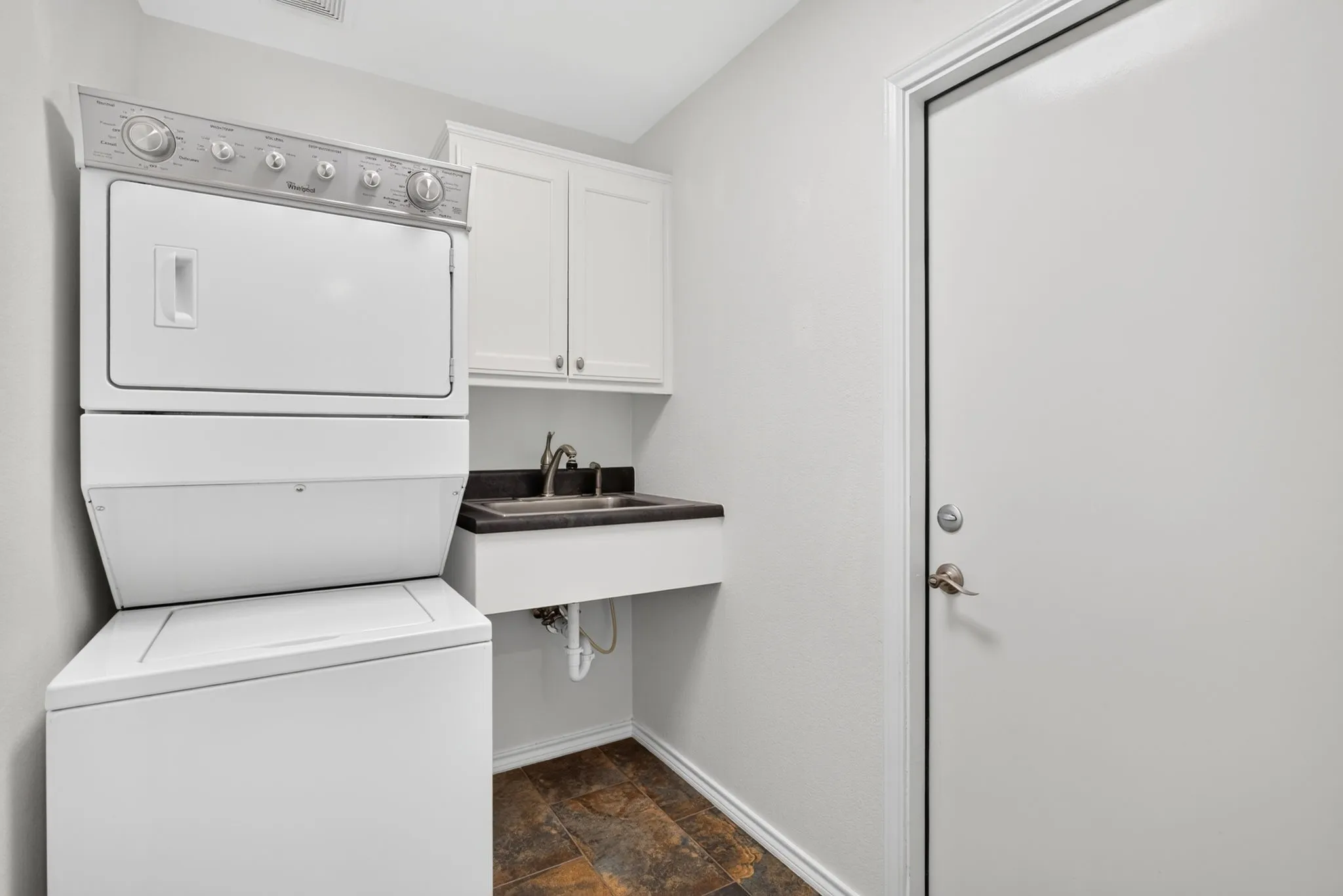 Pantry, stackable washer & dryer that conveys, plus a utility sink. GREAT use of this space!