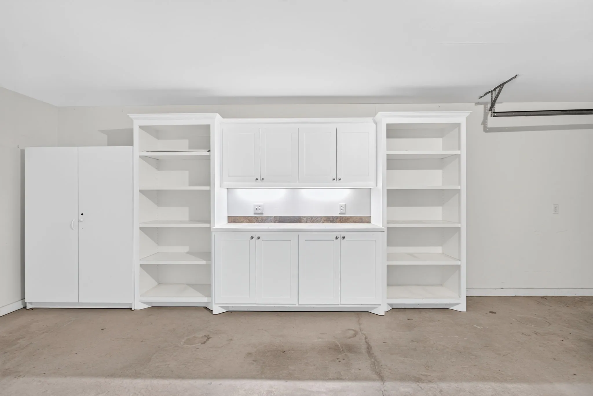 This cabinetry is so nice it could go inside the house - under-lit and again with adjustable shelving.