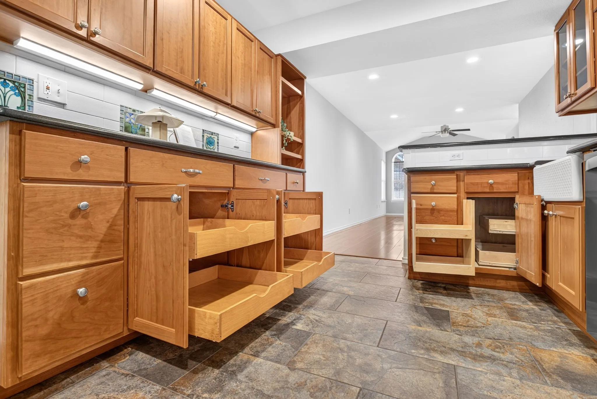 Y'all - how's that for customization? Pull-out drawers and fabulous use of the corner by the sink. Don't miss the spice cabinet by the oven!