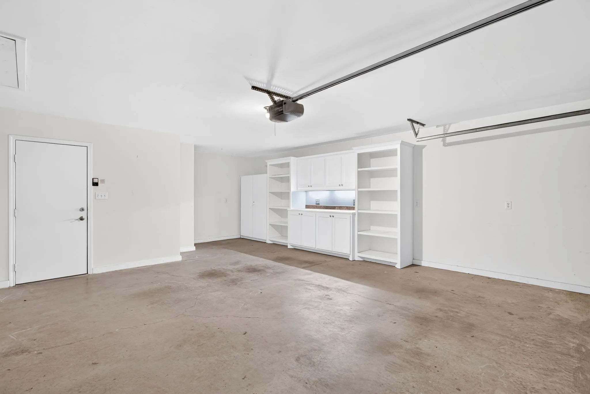 We normally don't photograph the garage...but guys! The space! The storage! The surge protector!