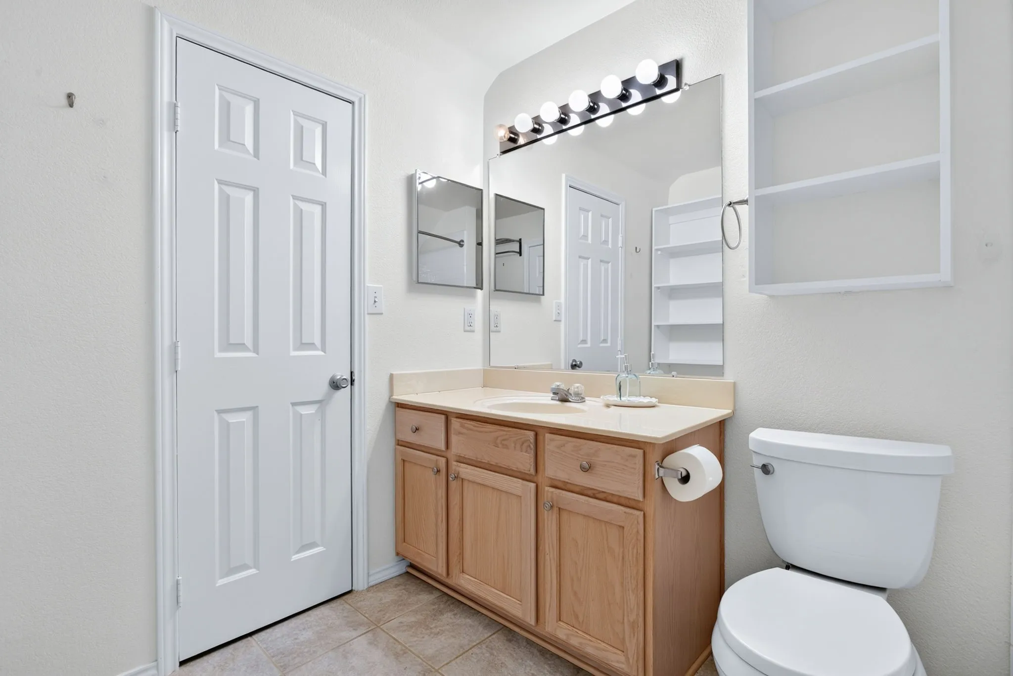 Upstairs full bathroom boasts a ton of storage, a big walk-in closet and extra shelving.