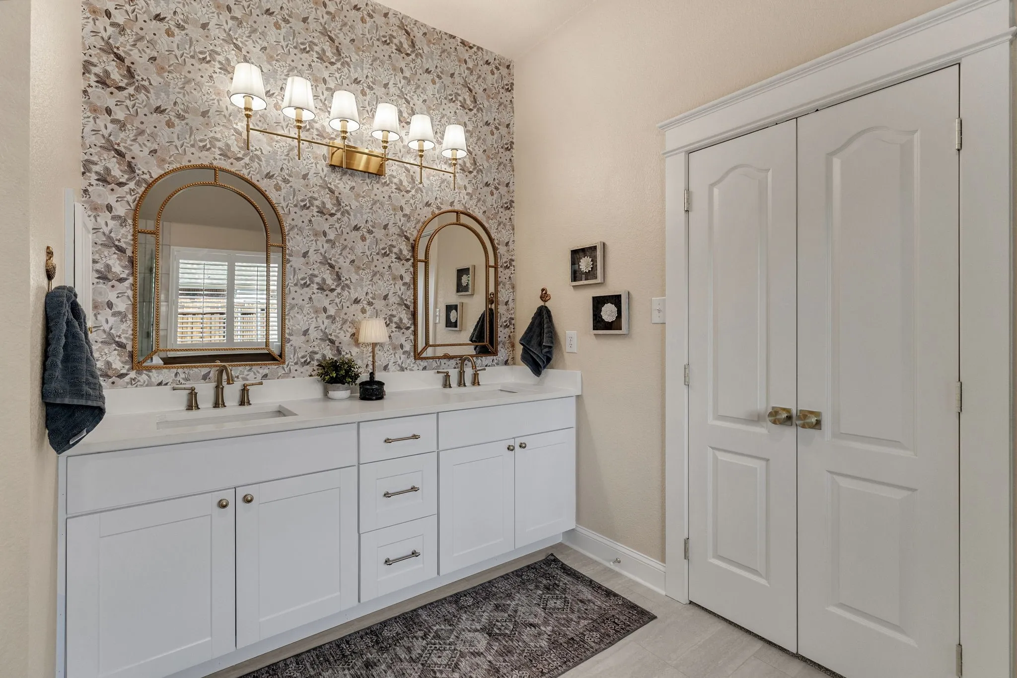 Double vanity with white cabinetry and integrated sinks