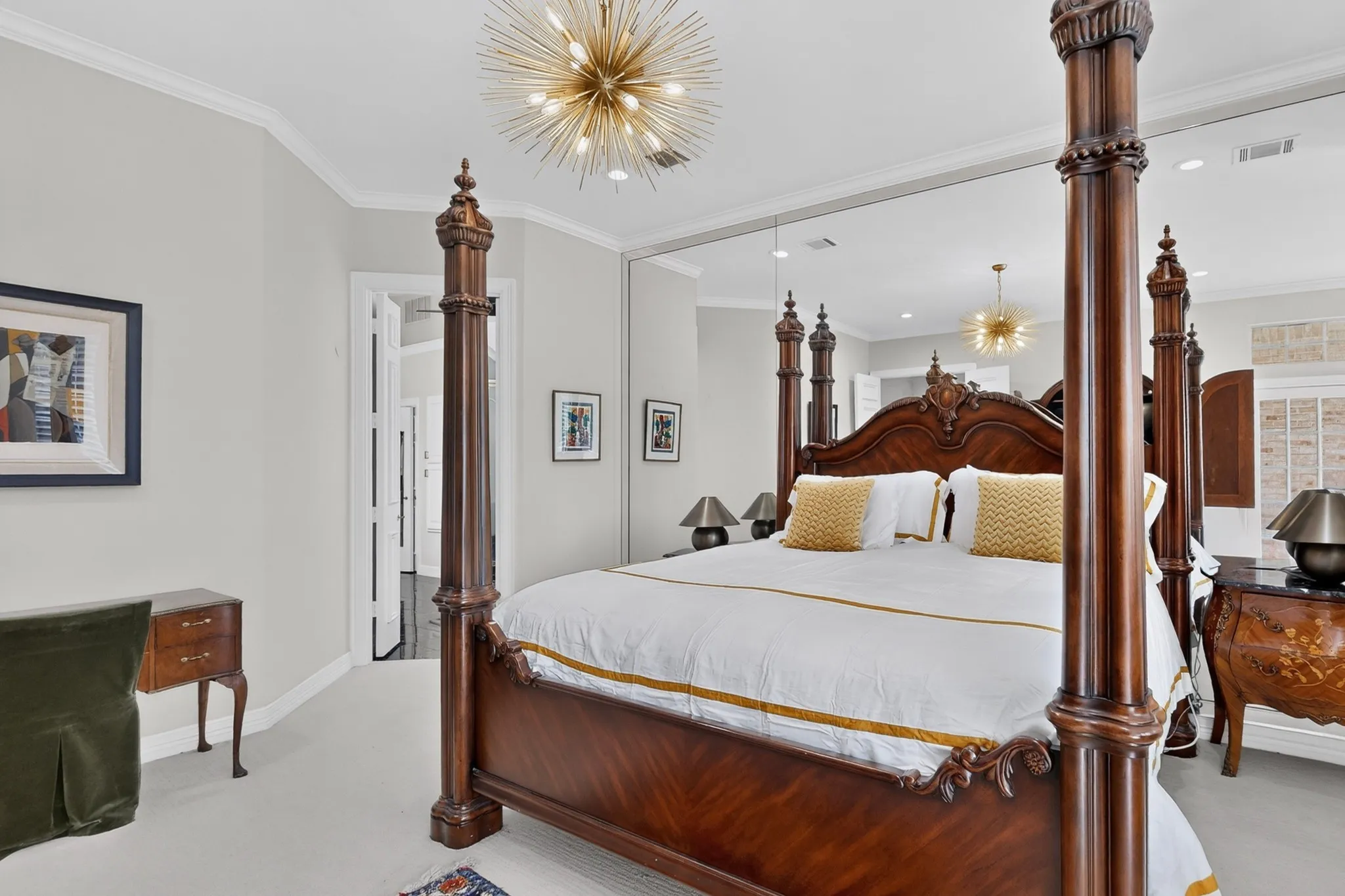 Crown molding, recessed lighting, and a unique sputnik-style chandelier