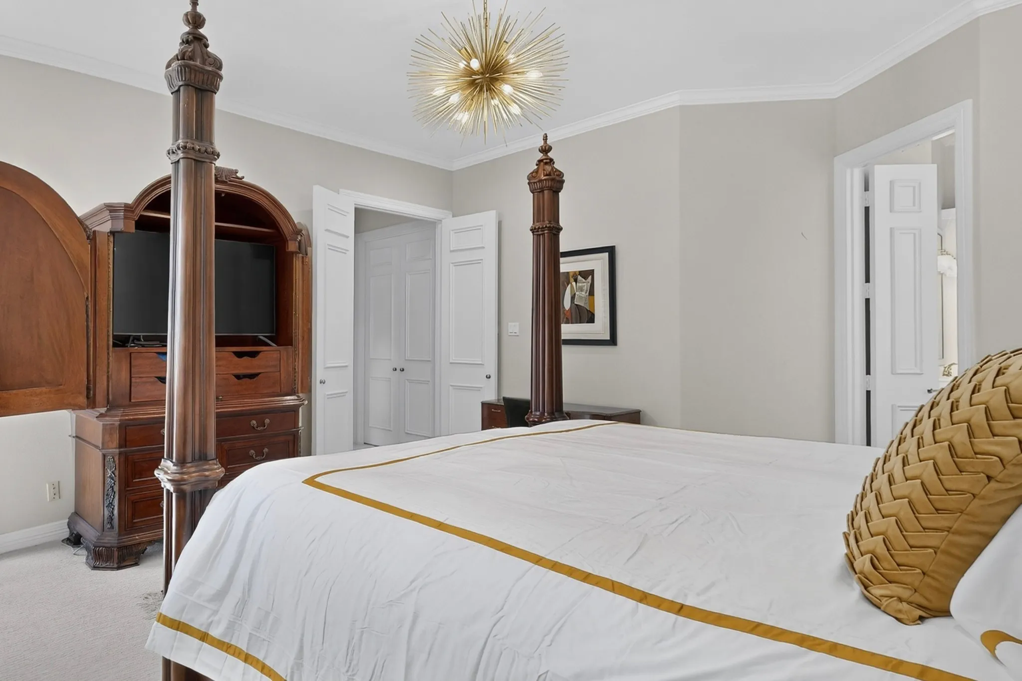 Recessed lighting, crown molding, and built-in wood cabinetry with storage