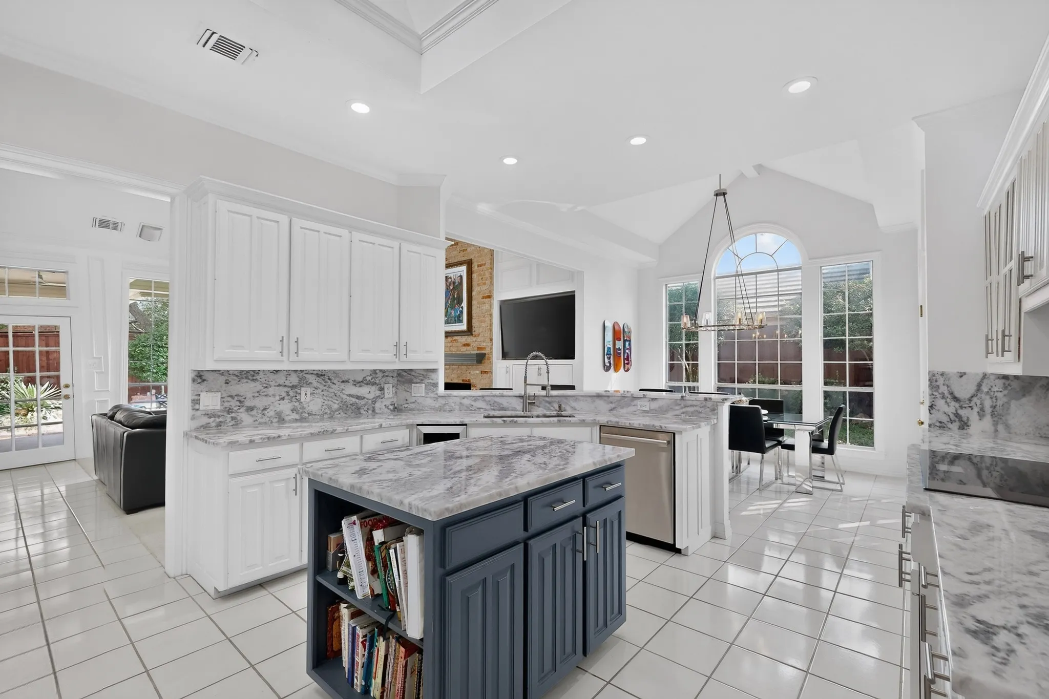 White cabinetry featuring stone countertops and backsplash