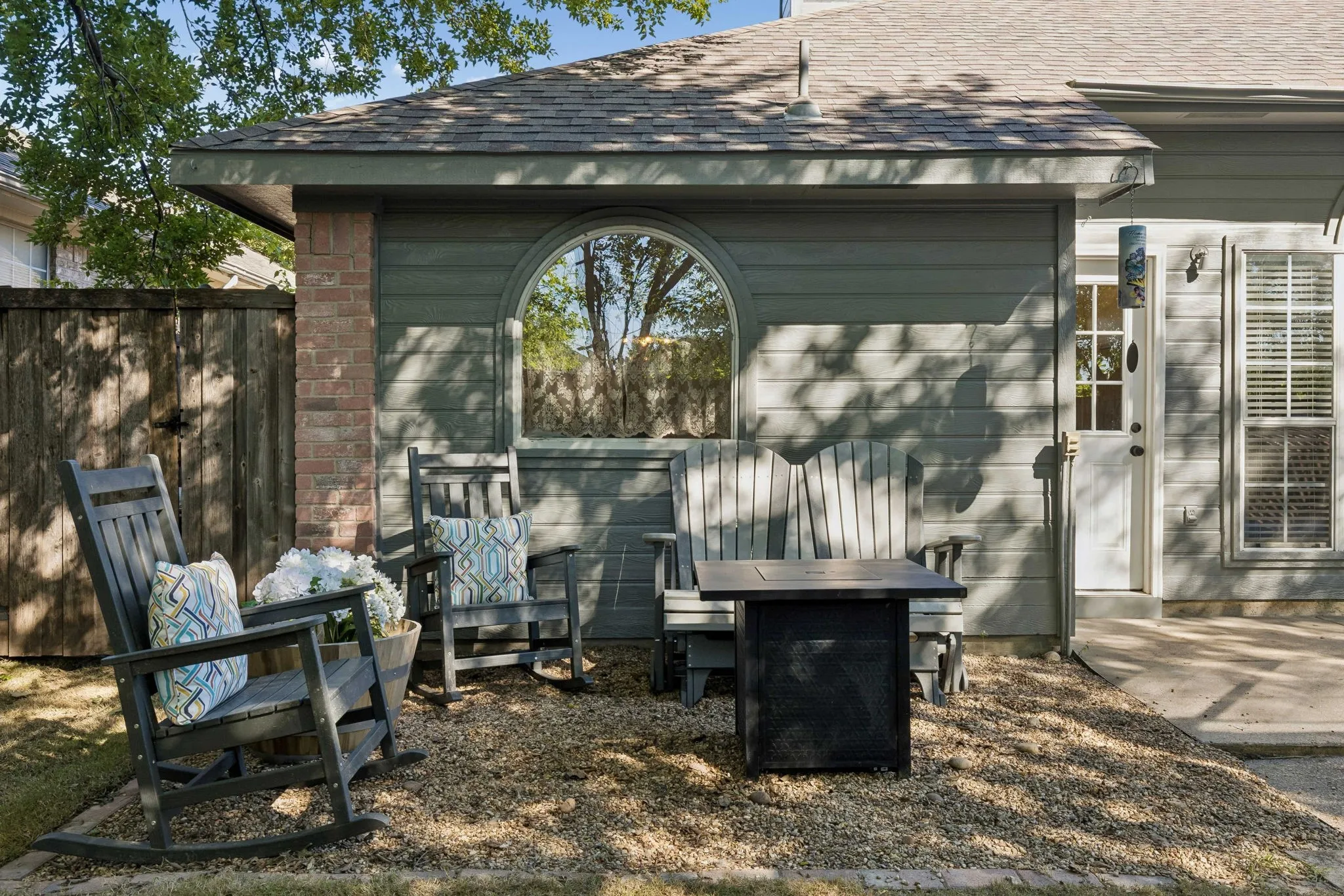 A closer view of the quaint gravel sitting area, perfect for fall or winter nights by a fire pit!