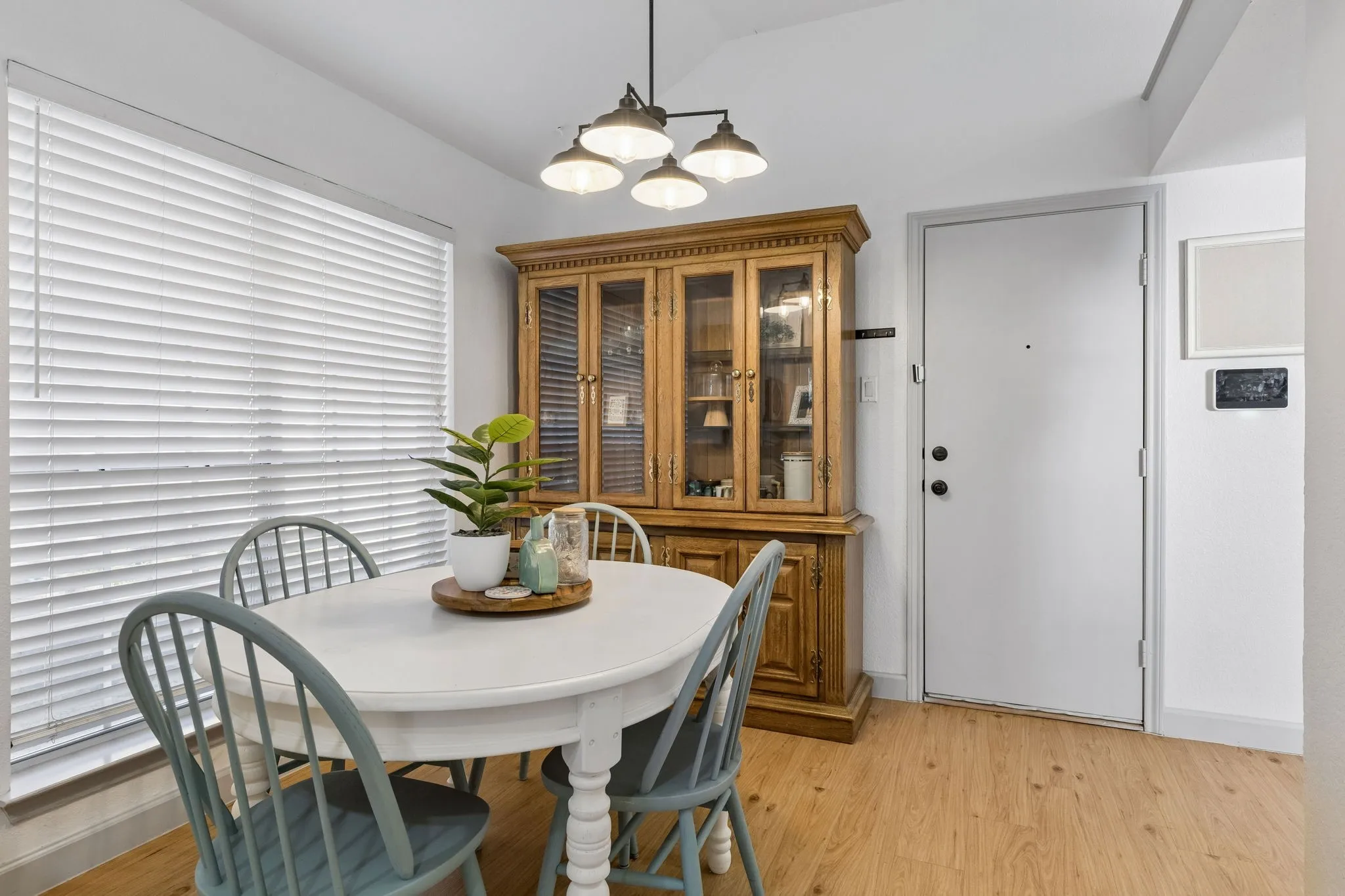 Another view of the spacious dining area with an updated light.