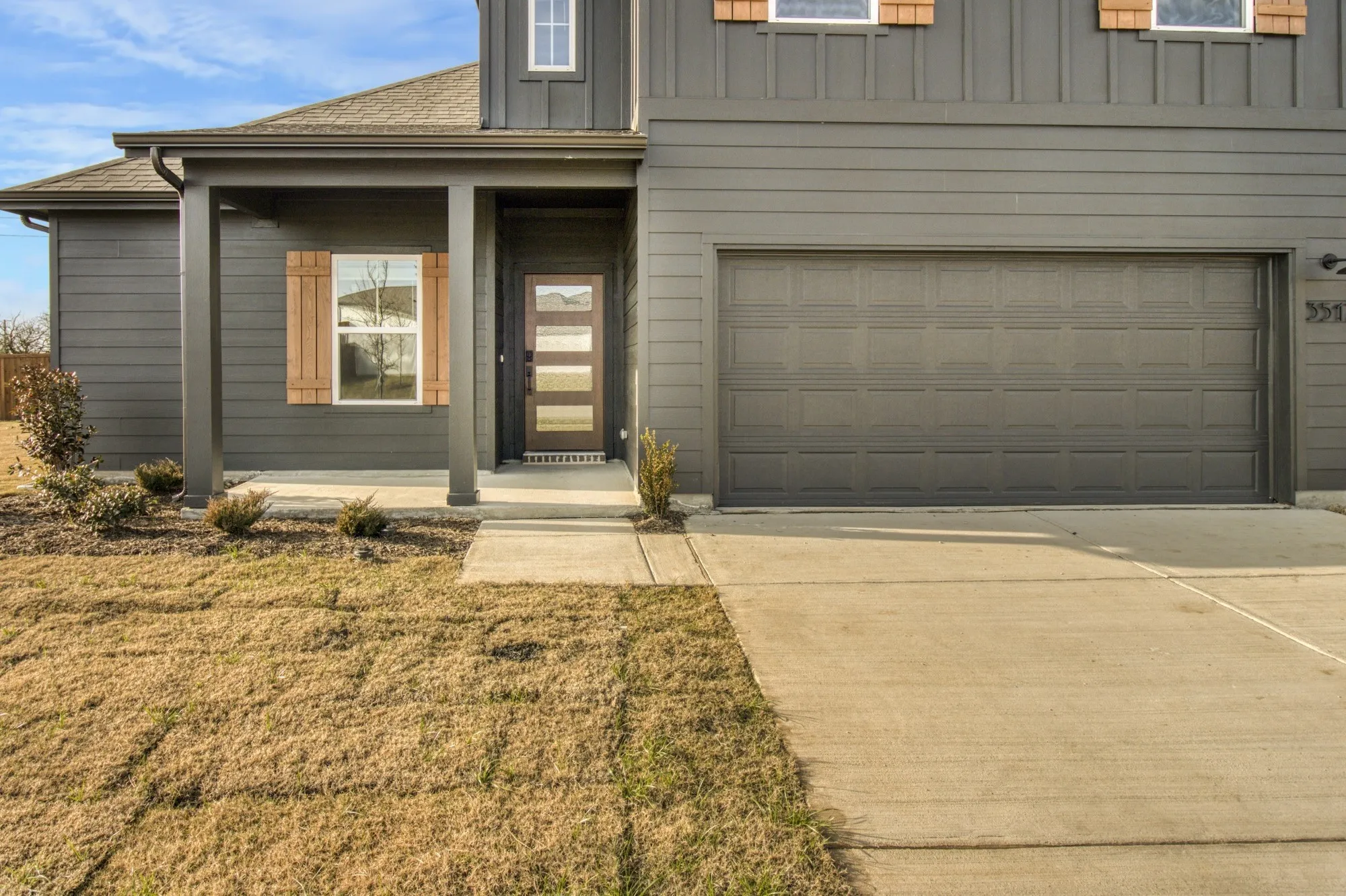 Dark gray exterior siding with board and batten accents