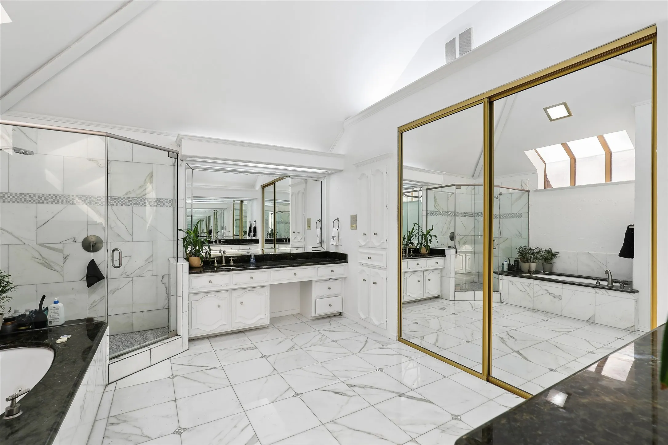 Spacious!  Dual vanities , soaking tub and luxury shower. indirect lighting and natural light.  Lot's of storage.