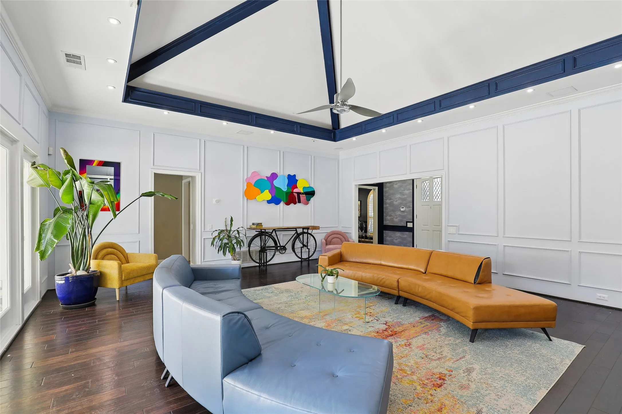 Not an old stuffy living room.  This serves as the hub of the home, connecting to the pool and patio as well as the private bedroom areas, kitchen, bar, and dining room.