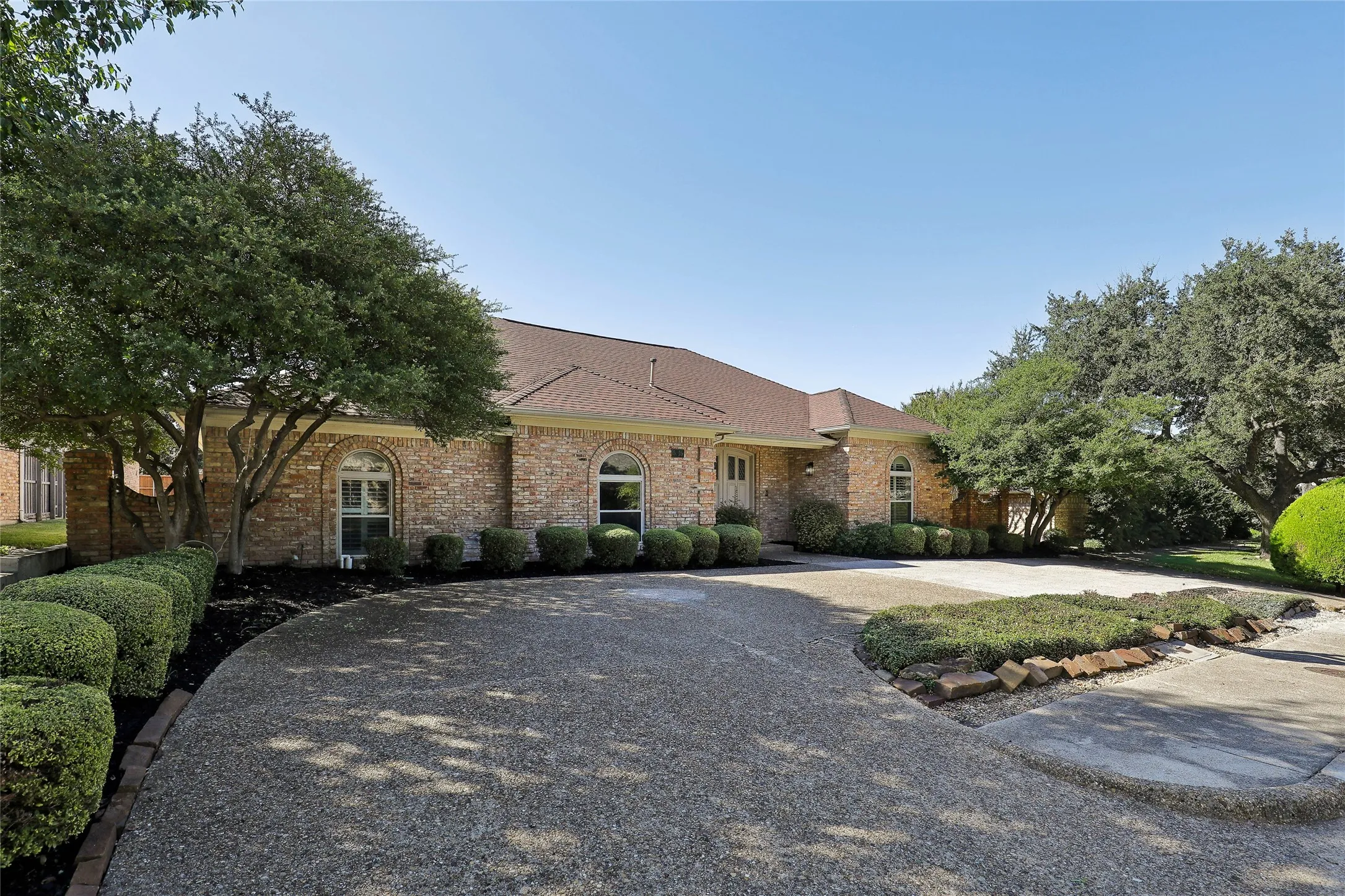 Brick exterior with an asphalt shingle roof