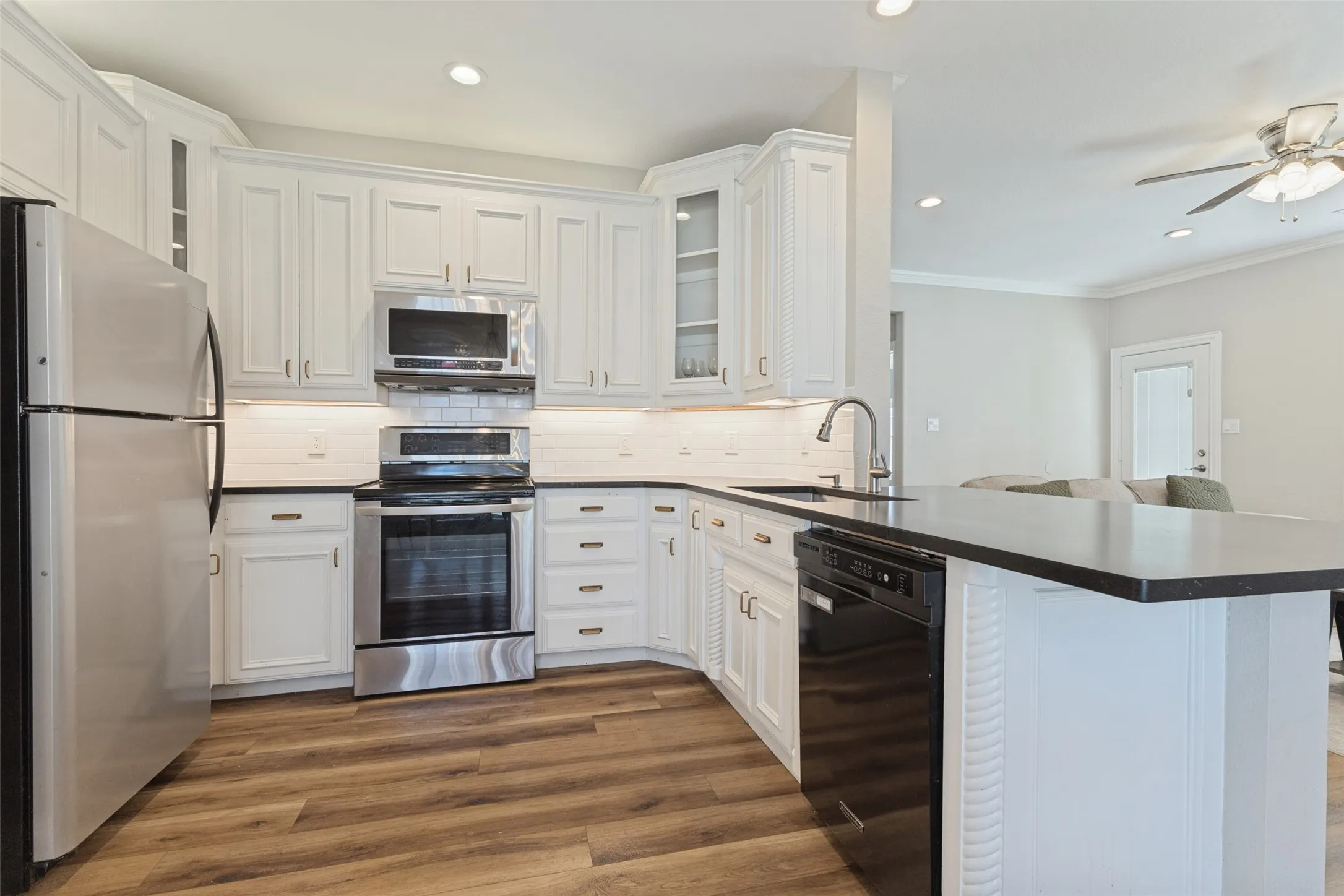 Bright and inviting kitchen with a functional layout and convenient access to the two adjoining dining areas