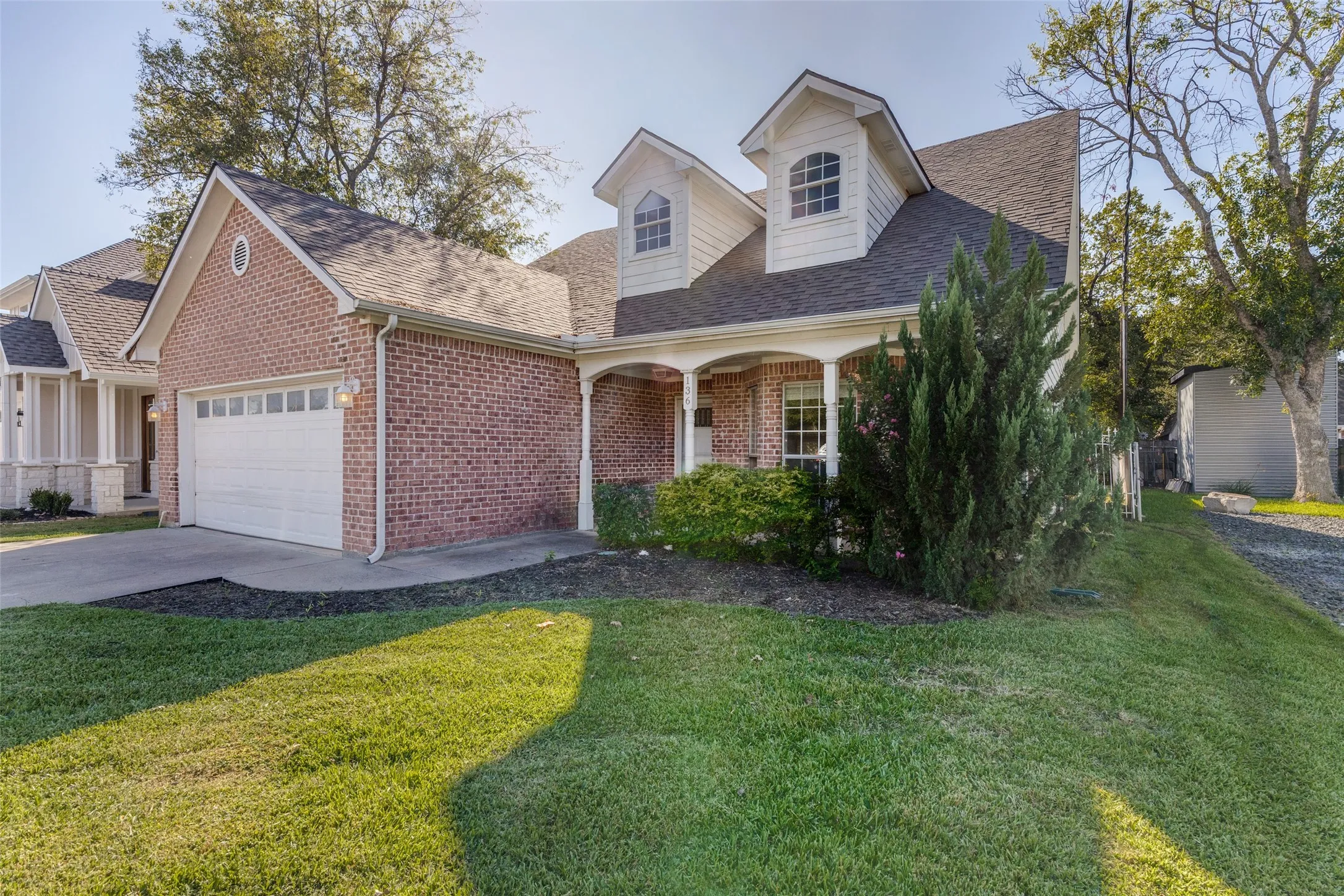 Charming curb appeal with a welcoming front entrance and an inviting exterior.