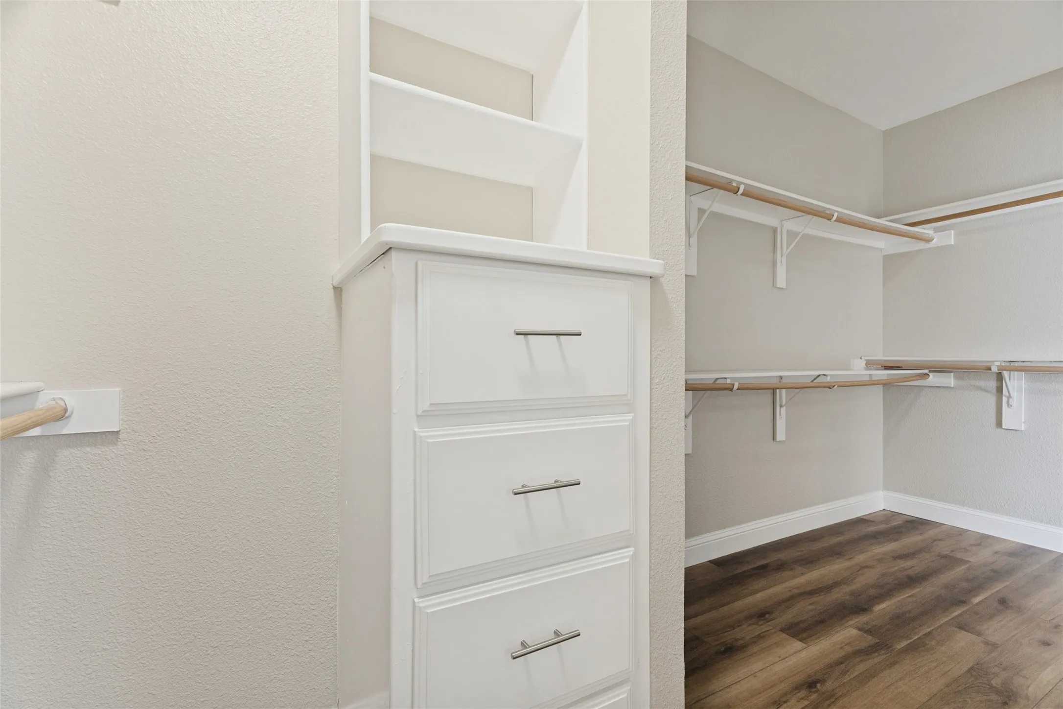 Oversized walk-in primary closet that wraps all the way around