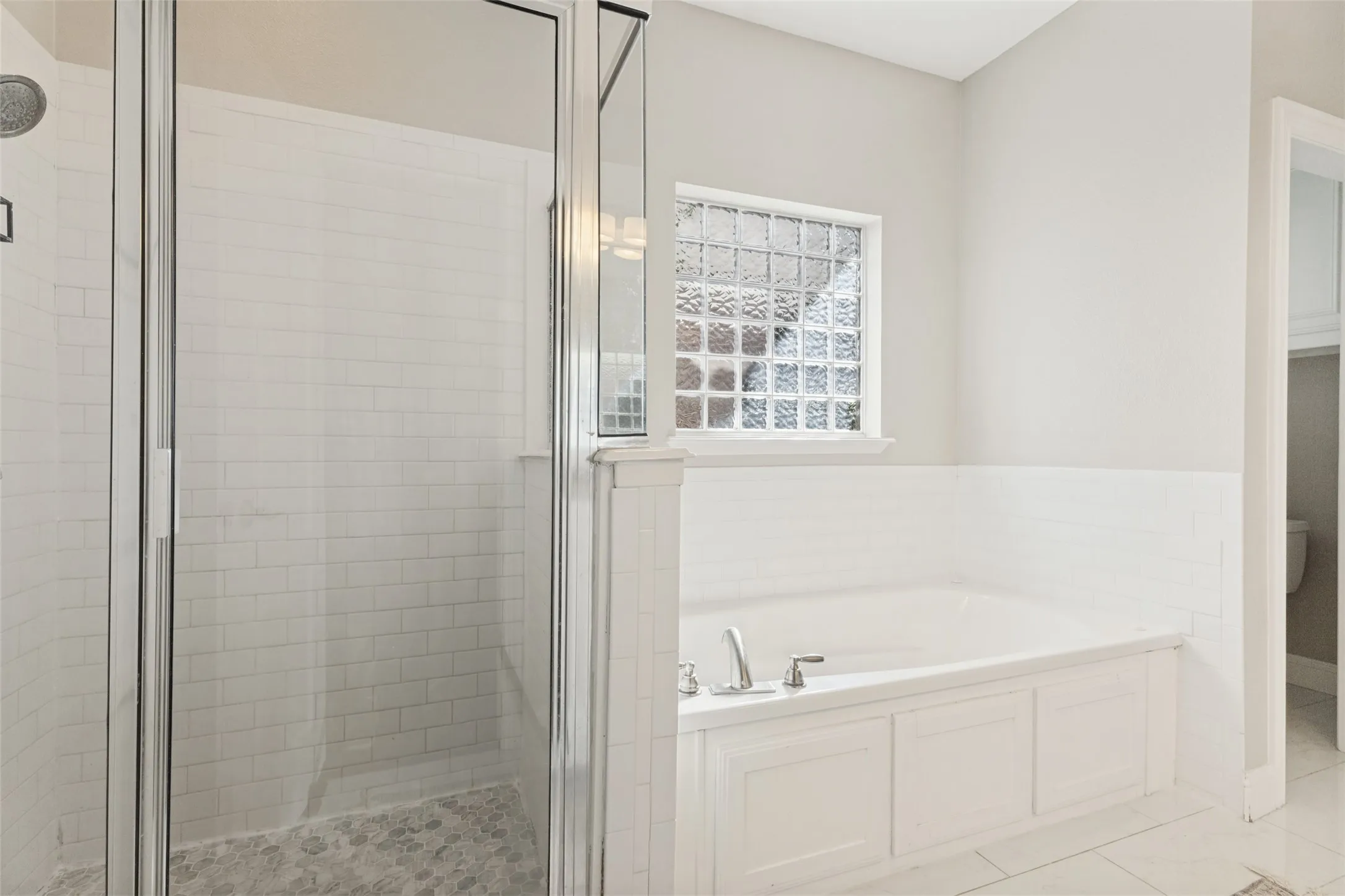 Primary bathroom with both shower and bathtub