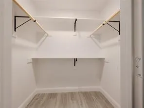 Large walk-in closet in primary bedroom.