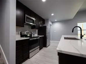 Kitchen appliances include refrigerator, range, microwave, and dishwasher.