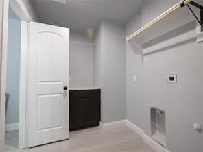 Plenty of room for washer and dryer; hanging rod; and folding cabinet. Half bathroom located inside utility room.
